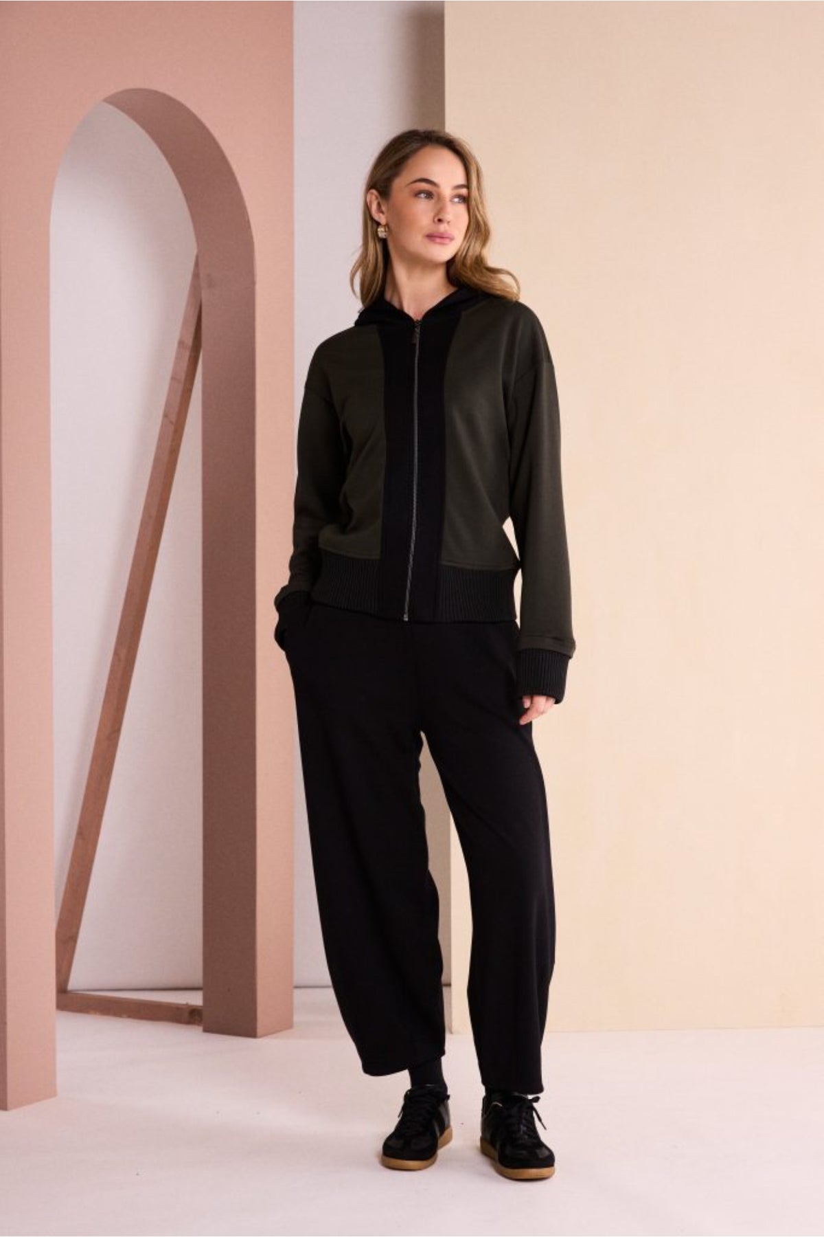 Naya NAW26144 Balloon Shaped Trouser with Darts at Hem Black worn by a model. Shop Naya at Dotique