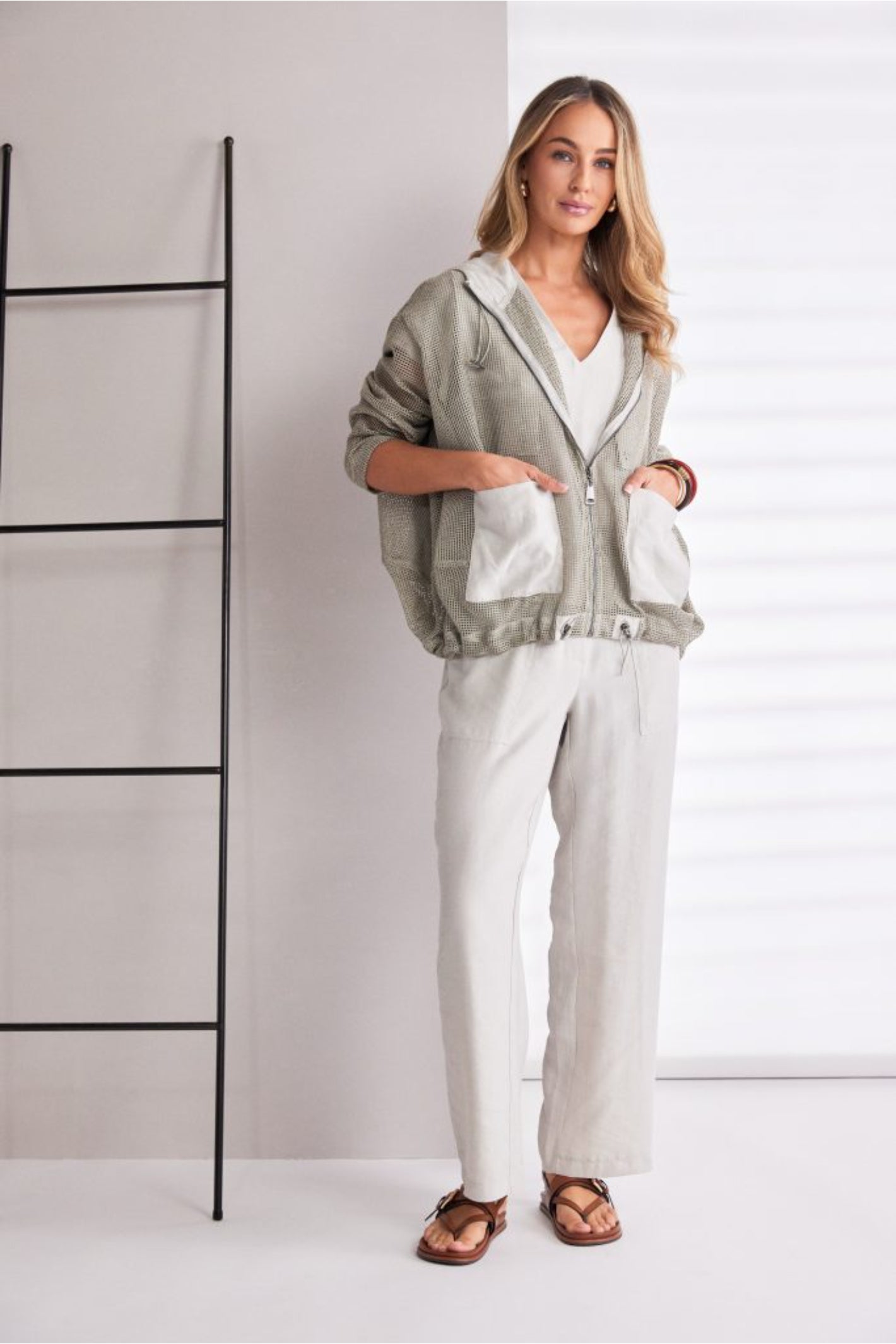 NAYA sand mesh hooded jacket featuring a zip front, contrast patch pockets, drawstring hem and relaxed fit design.