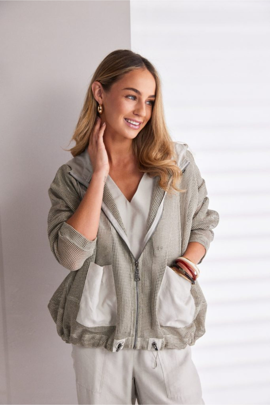 NAYA sand mesh hooded jacket featuring a zip front, contrast patch pockets, drawstring hem and relaxed fit design.