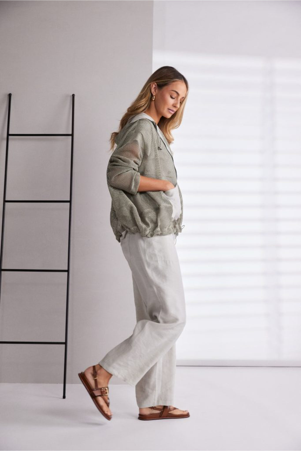 NAYA sand mesh hooded jacket featuring a zip front, contrast patch pockets, drawstring hem and relaxed fit design.
Shop now at Dotique.