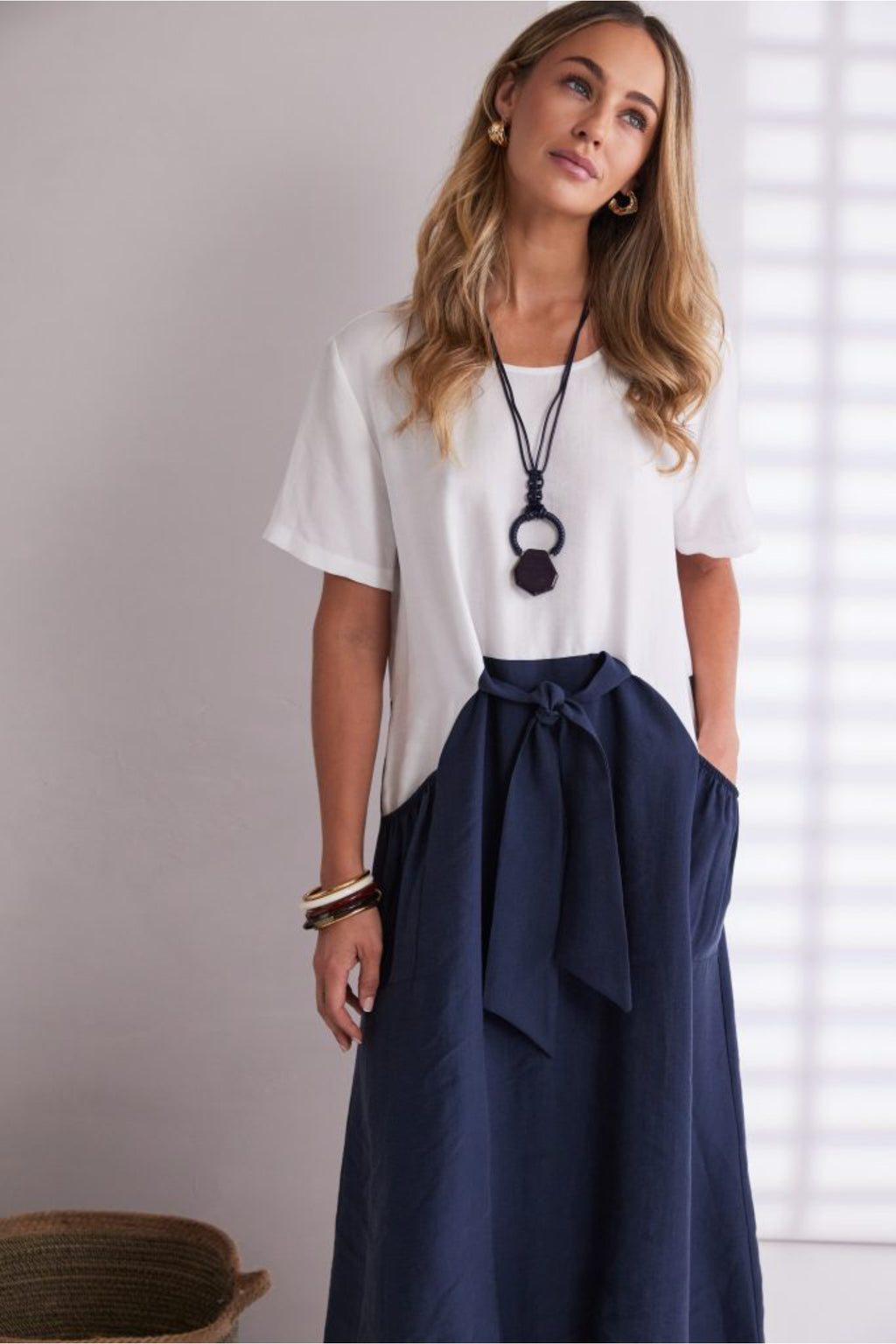 NAYA navy and white contrast midi dress featuring a round neckline, tie belt waist and statement pockets.