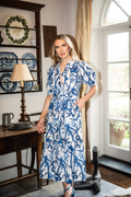 Woman wearing New Day Originals Safari Blue Shirt Dress in a blue and white botanical print, shop New Day Originals at Dotique