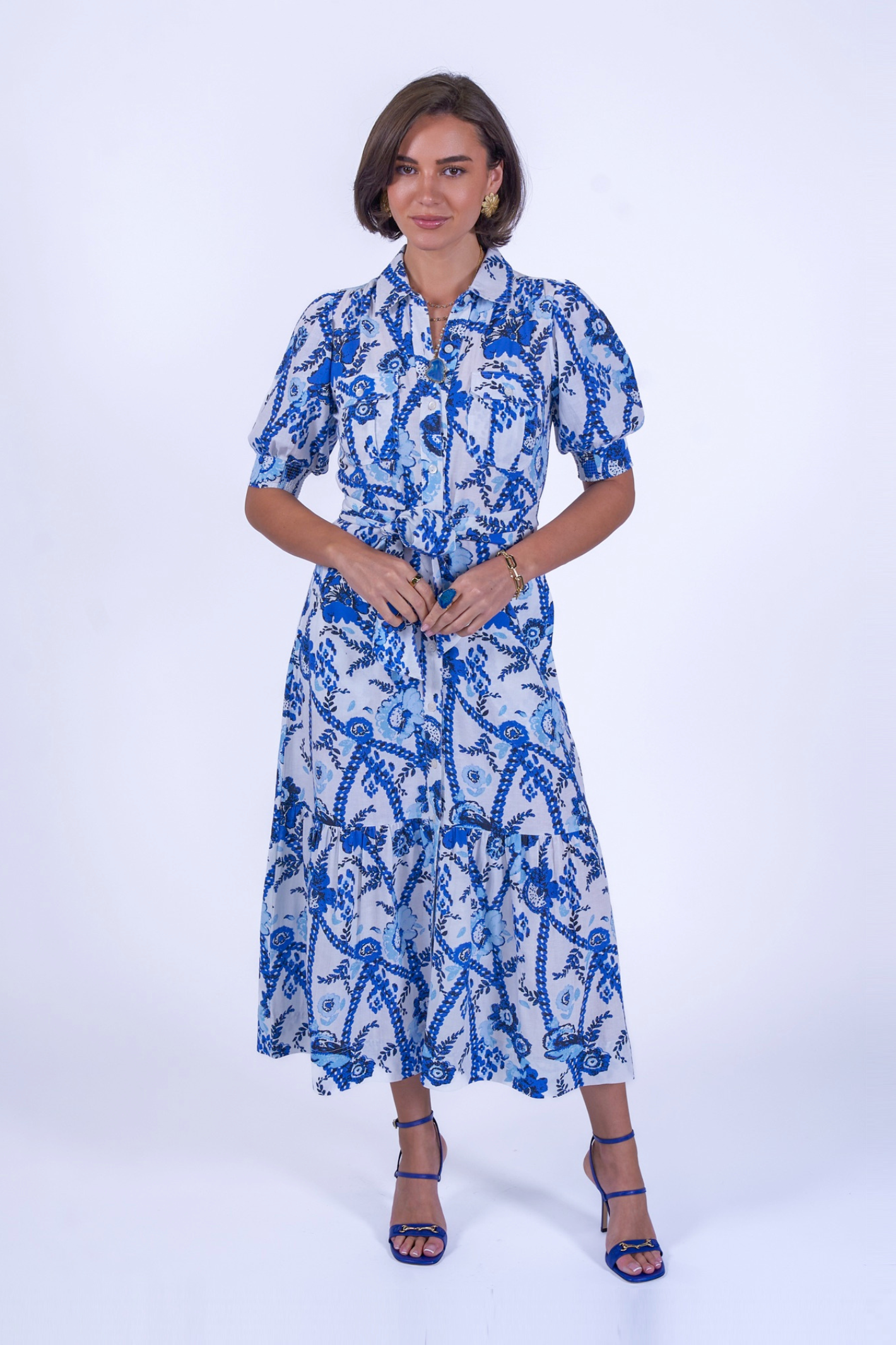 Woman wearing New Day Originals Safari Blue Shirt Dress with blue botanical print, shop New Day Originals at Dotique