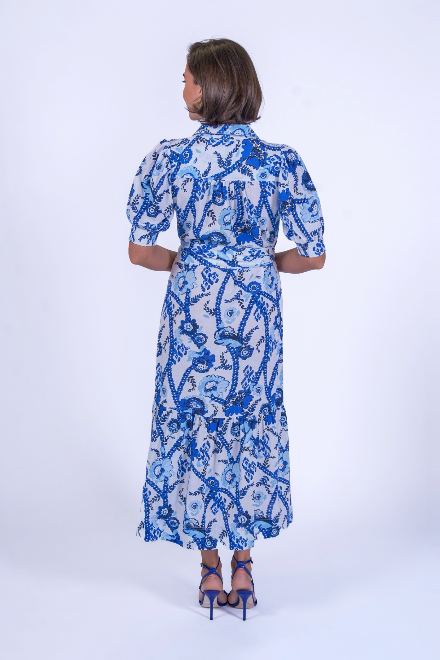 Back view of woman wearing New Day Originals Safari Blue Shirt Dress by New Day Originals, shop the vendor at Dotique.