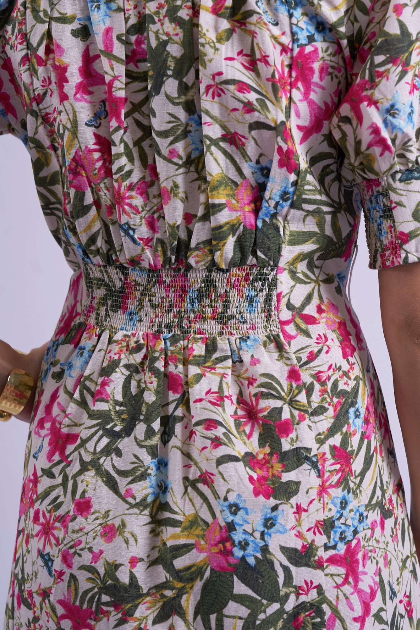 Close-up of smocked waist and floral fabric print on New Day Originals Sydney Dress Botanical by New Day Originals, shop the vendor at Dotique