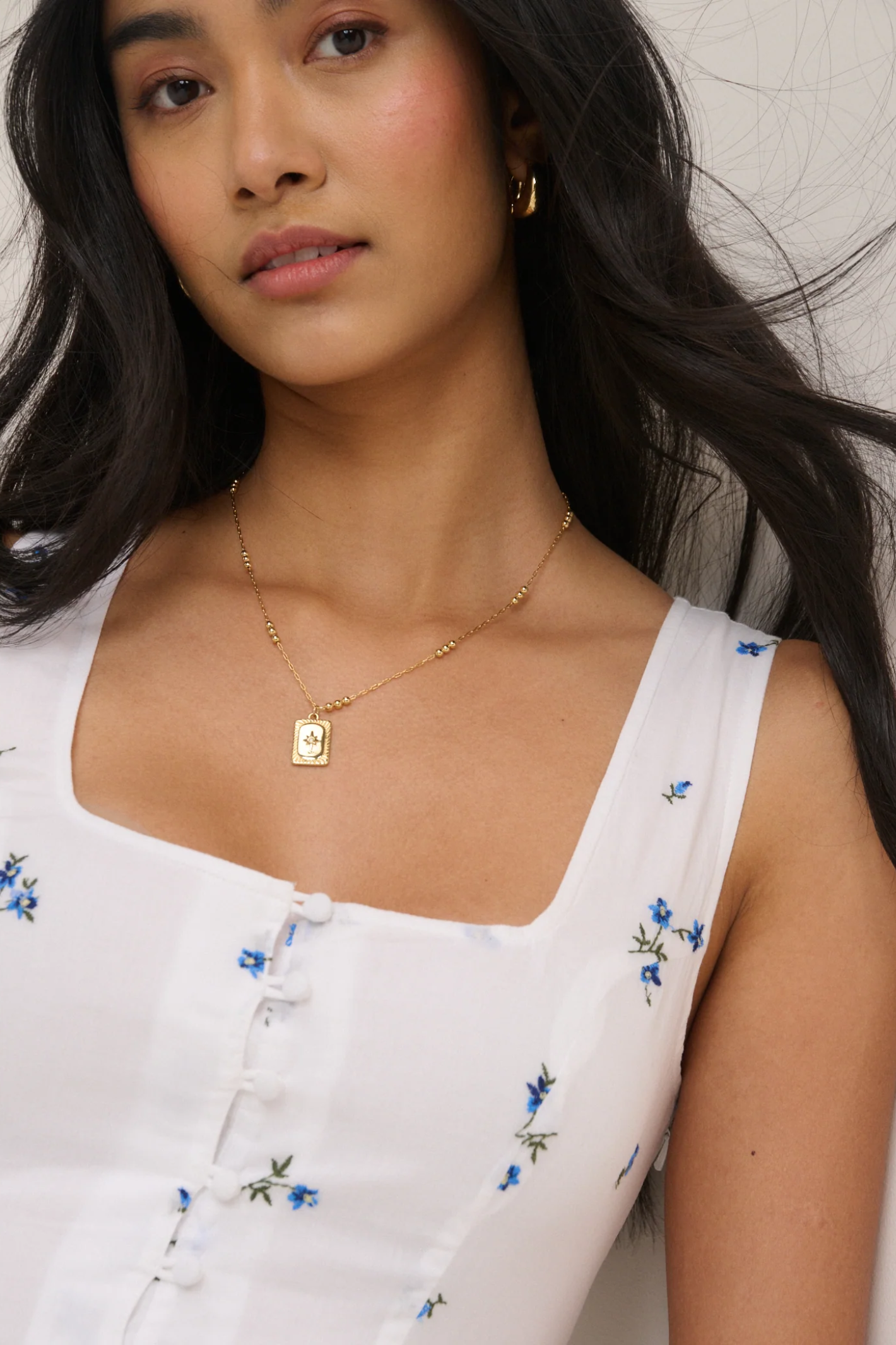 Close-up of a woman wearing Nobody's Child Cora White Midi Dress by Nobody’s Child, shop Nobody’s Child at Dotique.