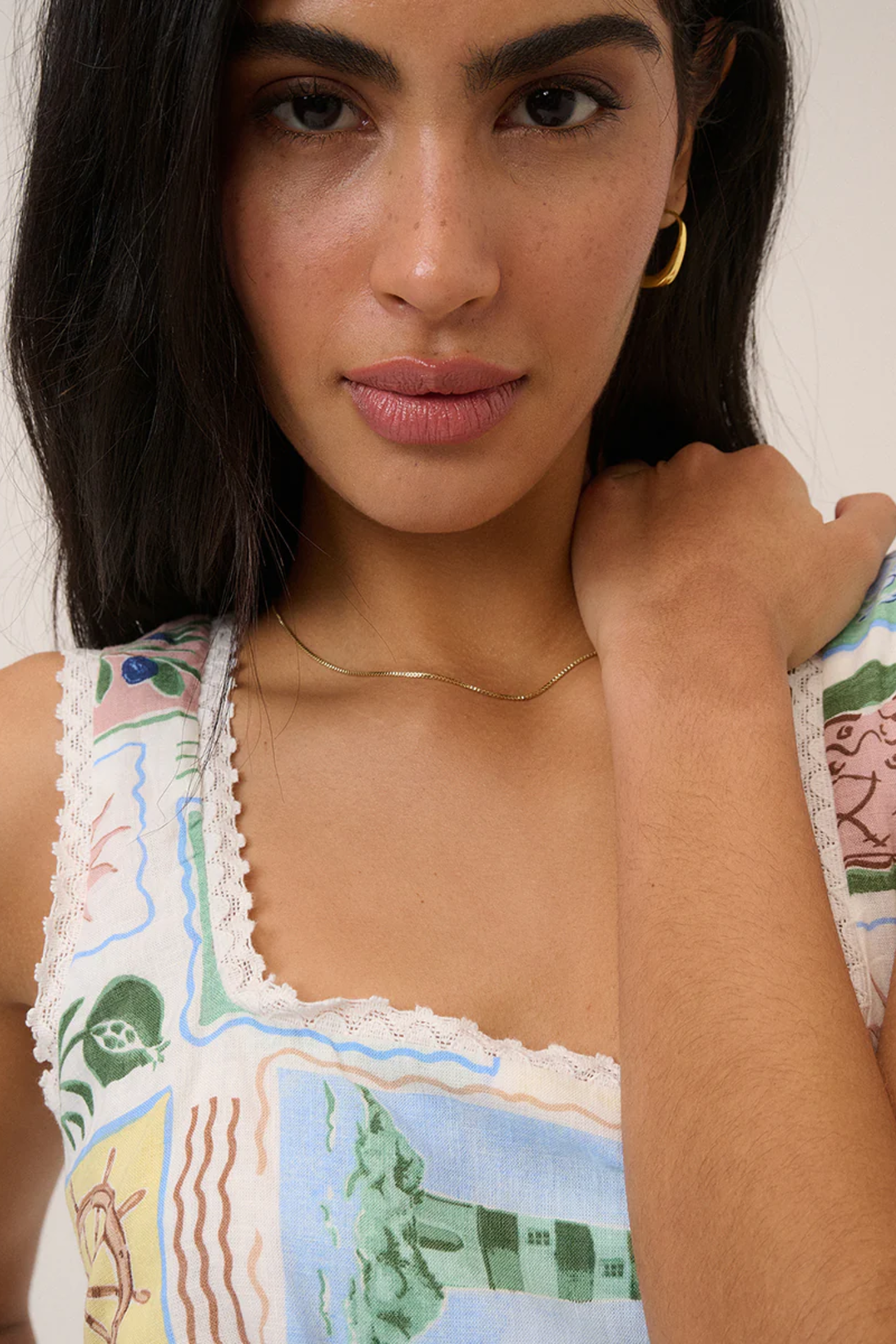 Close-up of a woman wearing Nobody's Child Ciara White Mini Dress by Nobody’s Child, shop Nobody’s Child at Dotique.