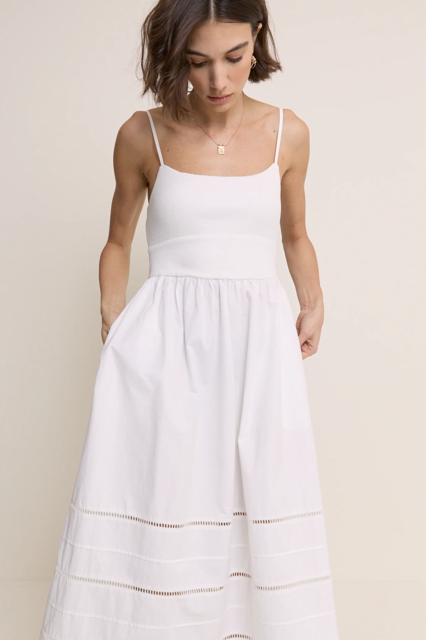 Model wearing Nobody’s Child White Strappy Tiered Goldie Midi Dress by Nobody’s Child, shop Nobody’s Child at Dotique.
