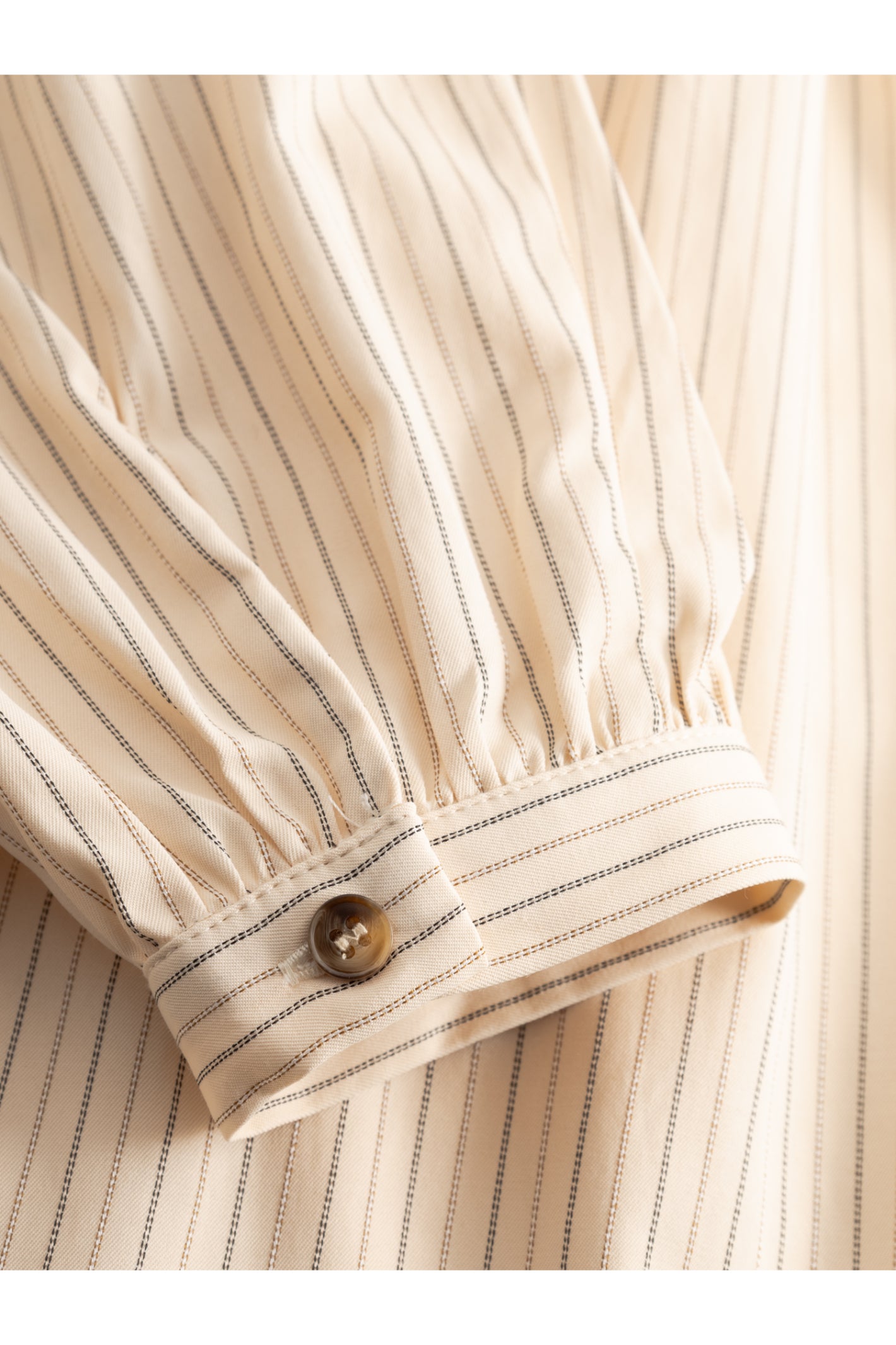 Close-up of cuff with button on Noella 15360001 N-Mikayla Blouse Donnie Cream Stripe by noella shop noella at Dotique