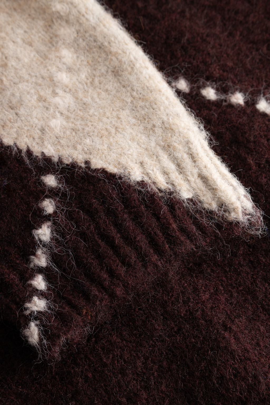 The Noella Lai Knit Jumper in Winetasting Mix brings a softer, more feminine take on the Highland Romance trend. Shop Noella at Dotique.