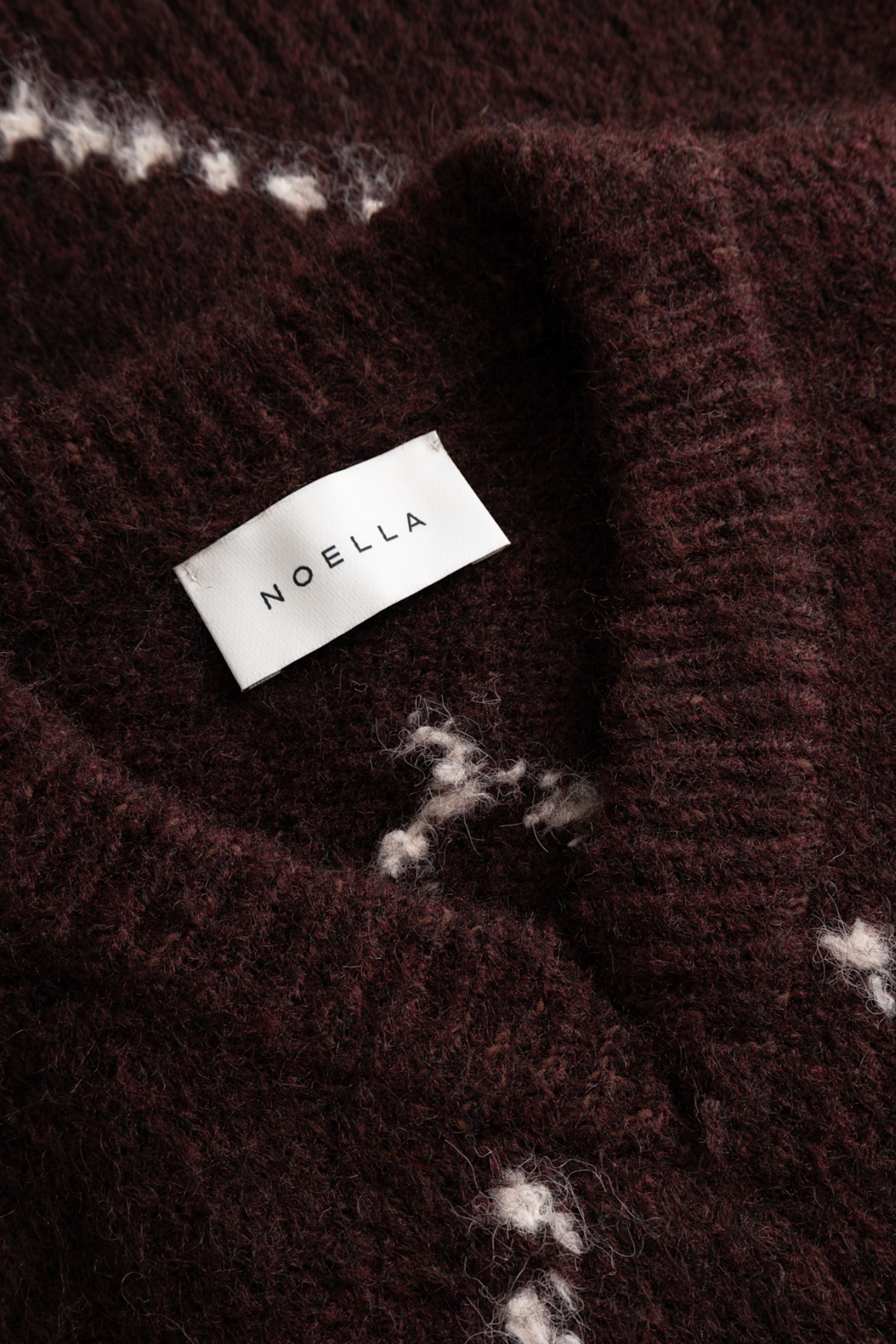The Noella Lai Knit Jumper in Winetasting Mix brings a softer, more feminine take on the Highland Romance trend. Shop Noella at Dotique.