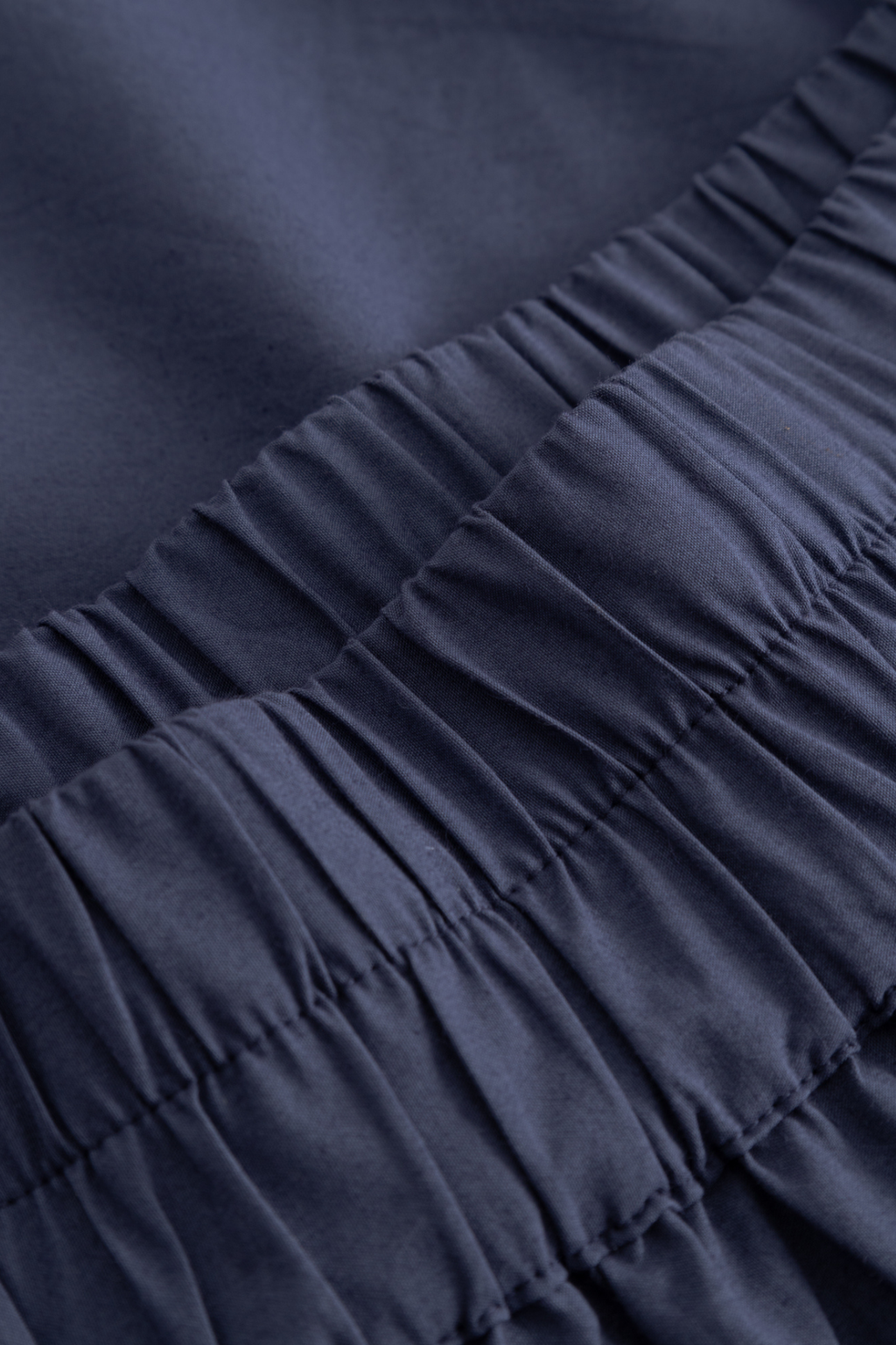 Noella dusty blue cotton skirt with elastic waistband and broderie anglaise hem