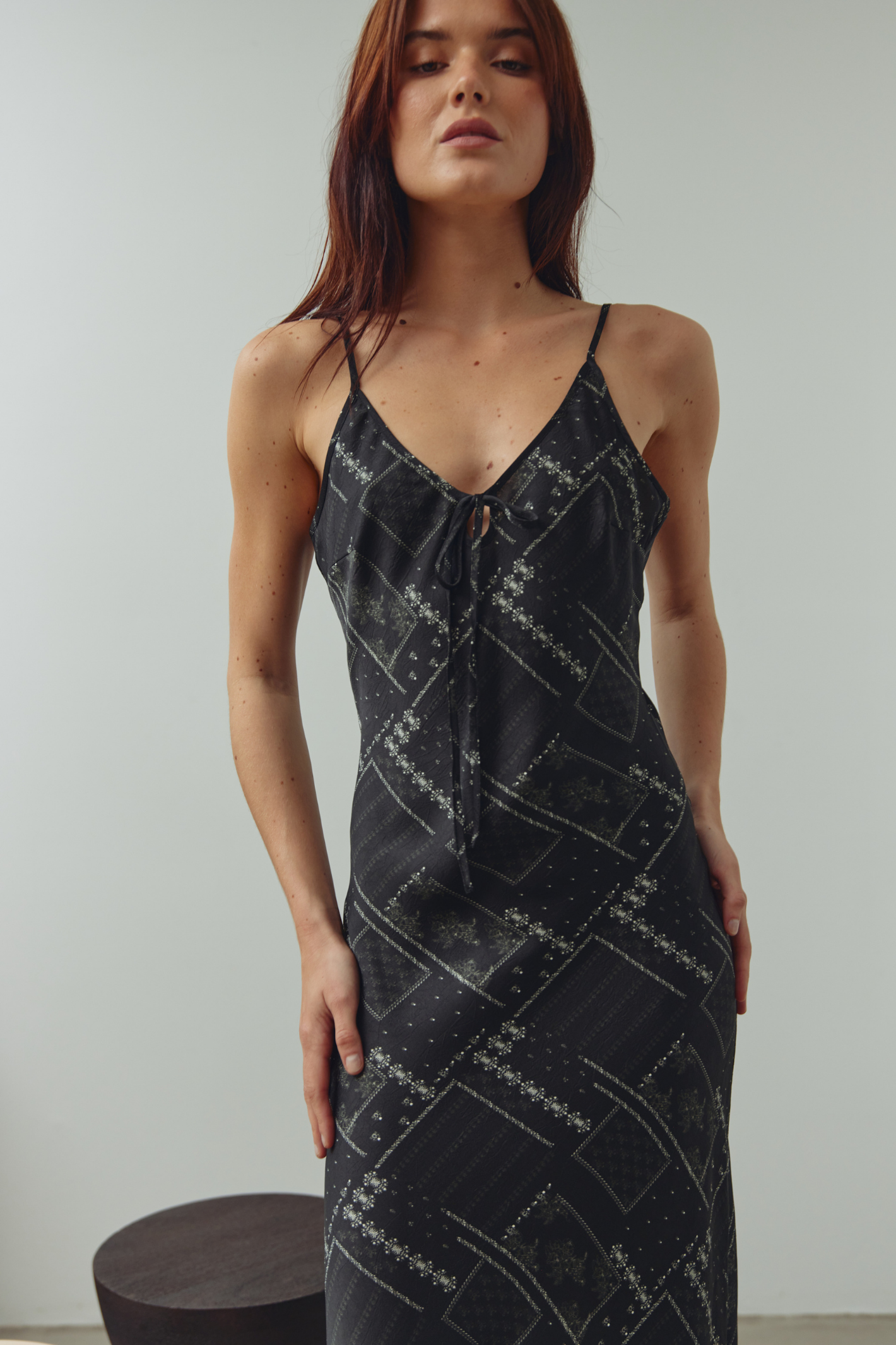 Noella black printed strappy dress with tie front detail and defined waist. Shop Noella at Dotique.