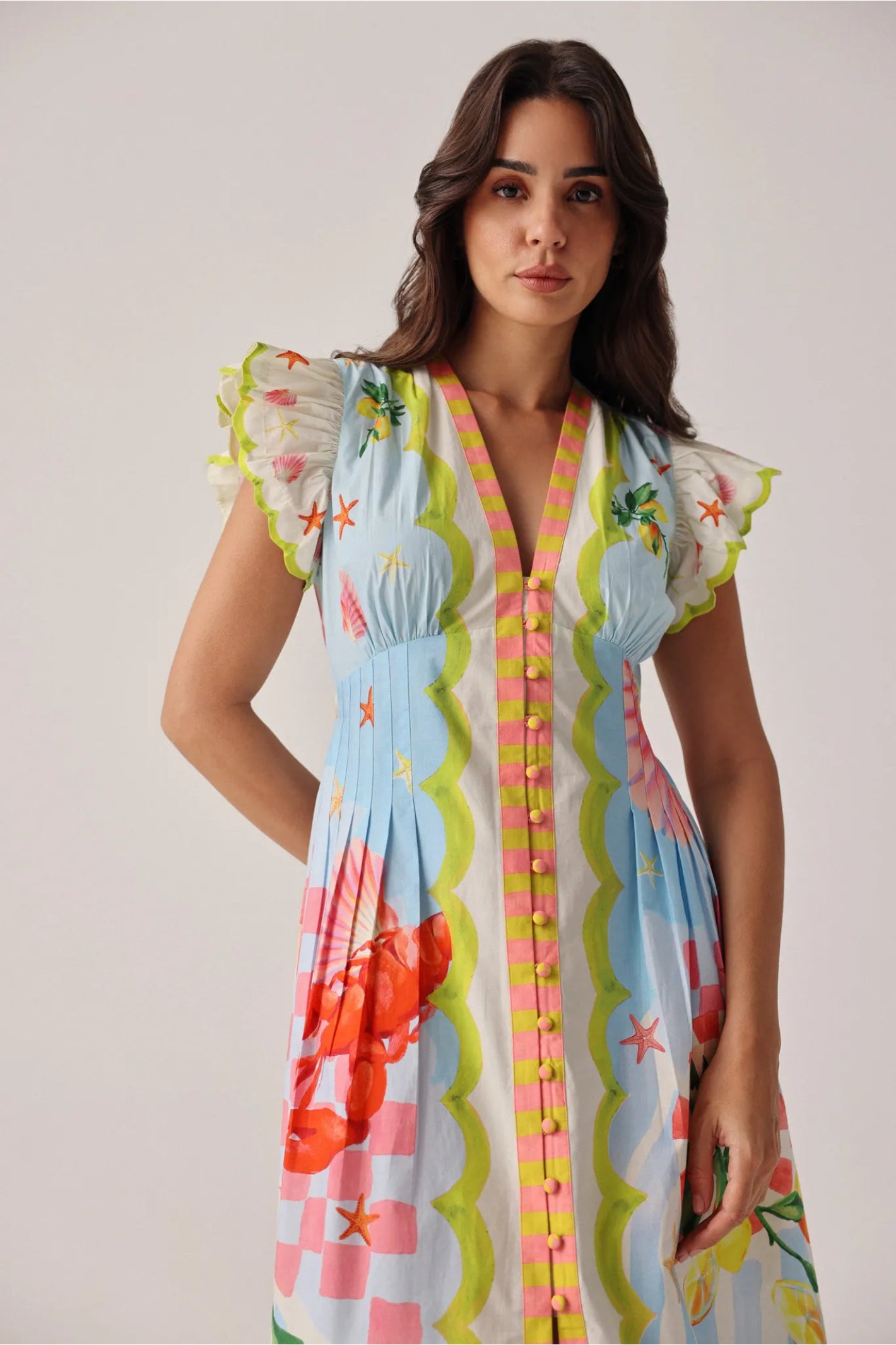 Woman wearing NOIB Estella Maxi Dress - Summer Zest by Noib with colorful sea-inspired print, shop Noib at Dotique