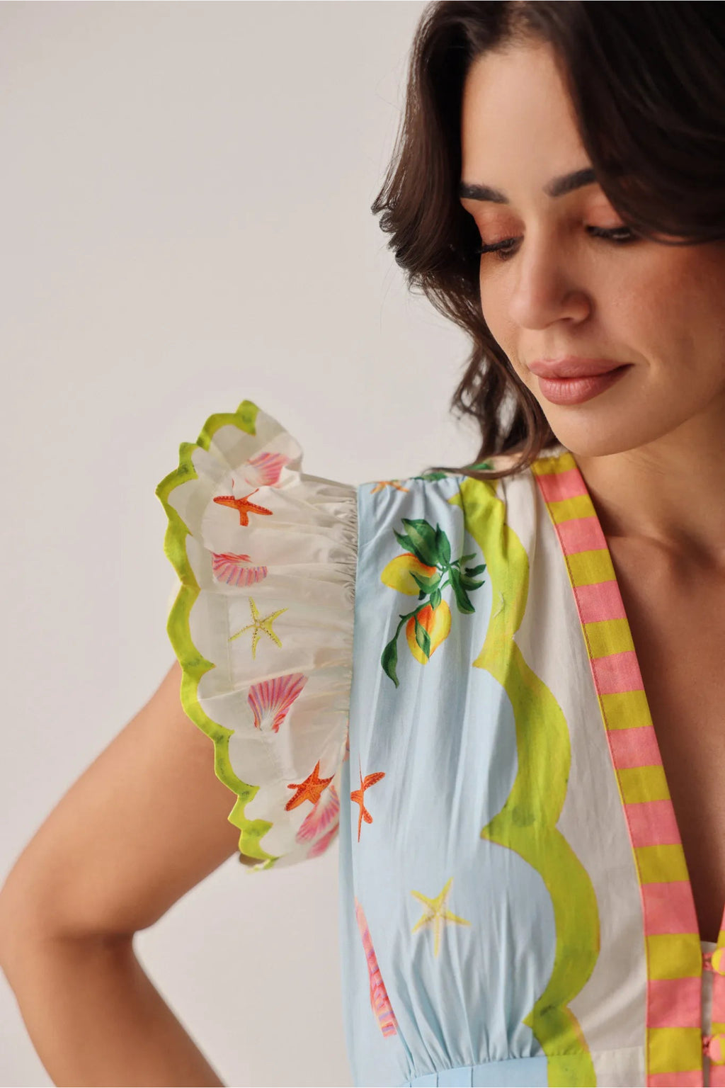 Close-up of sleeve detail on NOIB Estella Maxi Dress - Summer Zest by Noib with floral and sea-inspired print, shop Noib at Dotique