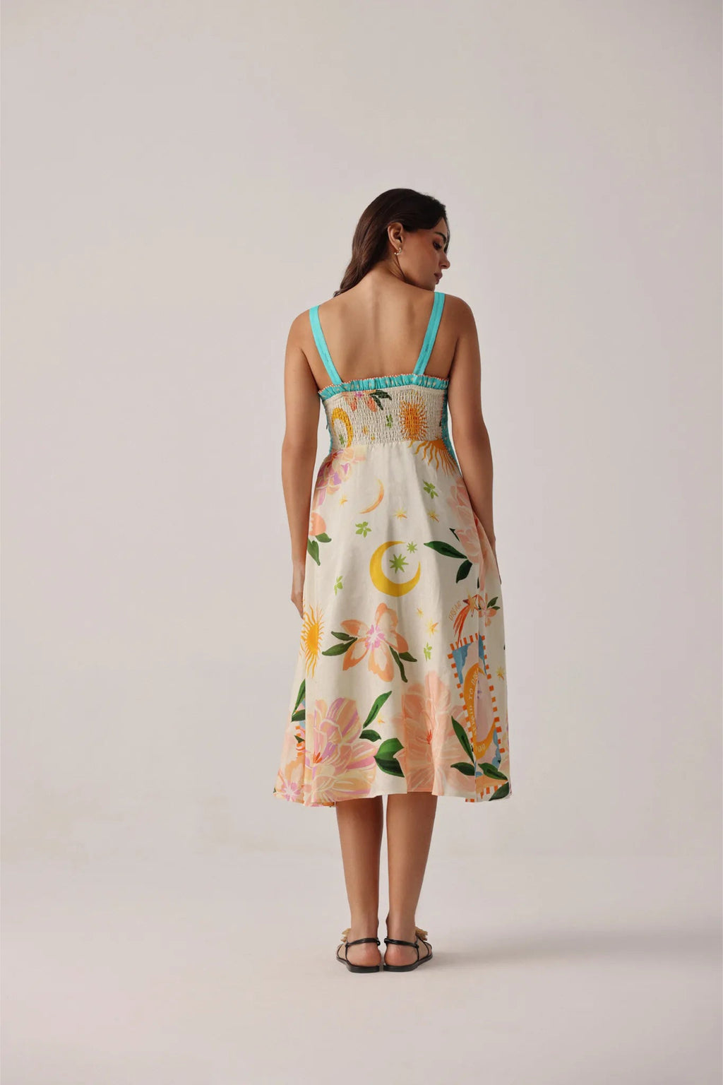 Model wearing NOIB Nora Midi Azure Print Viscose Linen Dress by Noib with floral and celestial motifs, shop Noib at Dotique