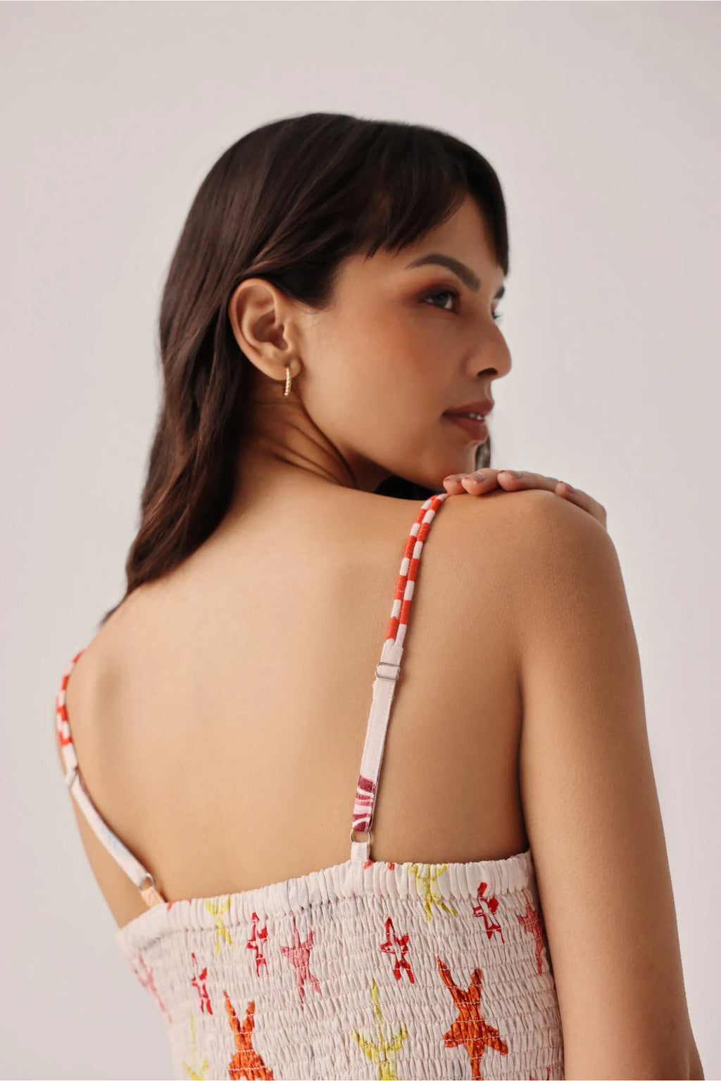 Model wearing NOIB Ruby Maxi Seaborn Dress by Noib with playful starfish and coral print, shop Noib at Dotique