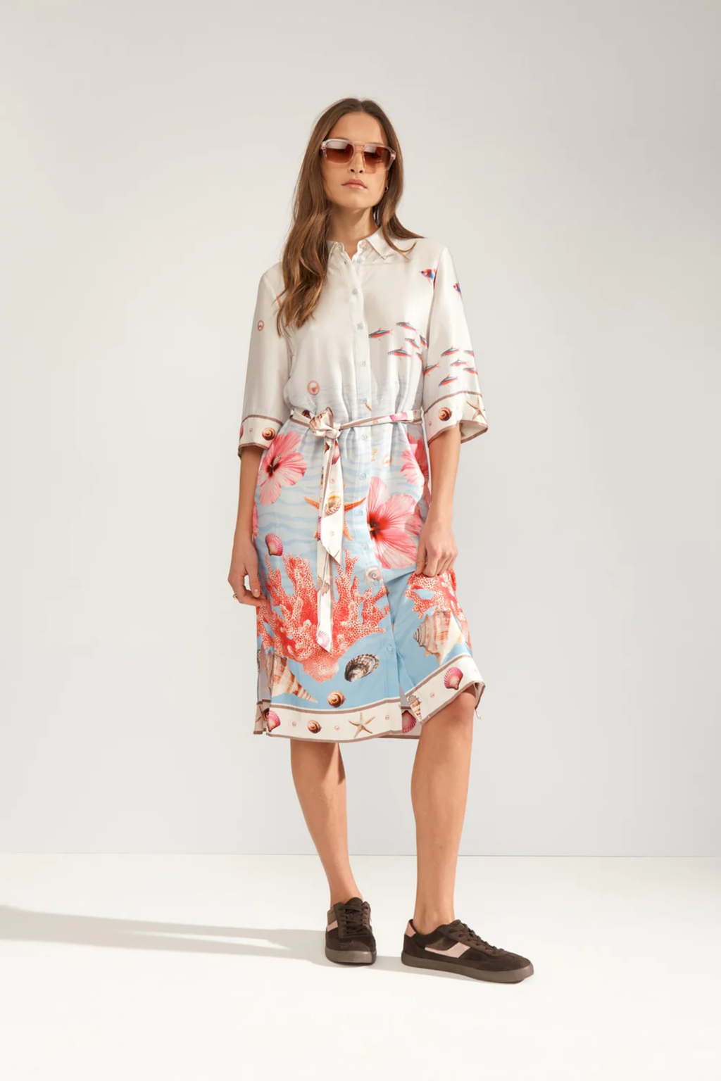 Model wearing Numph 706753 Nuoceana Shirt Dress Skyway with sea-inspired coral and shell print by Numph, shop Numph at Dotique.