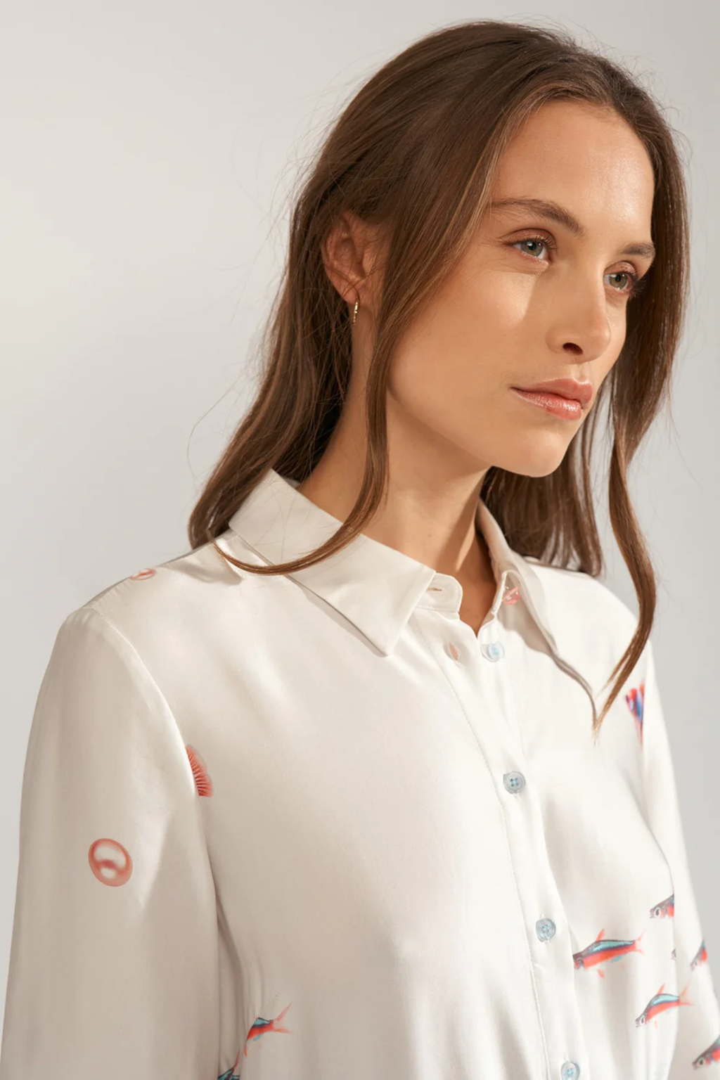 Close-up of a model wearing Numph 706753 Nuoceana Shirt Dress Skyway with a delicate sea-inspired print by Numph, shop Numph at Dotique.