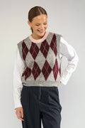Shop the Nümph NUTIKLA Vest in Medium Grey Melange at Dotique. A wool blend argyle knitted vest in grey and burgundy with a contrasting pink neckline.