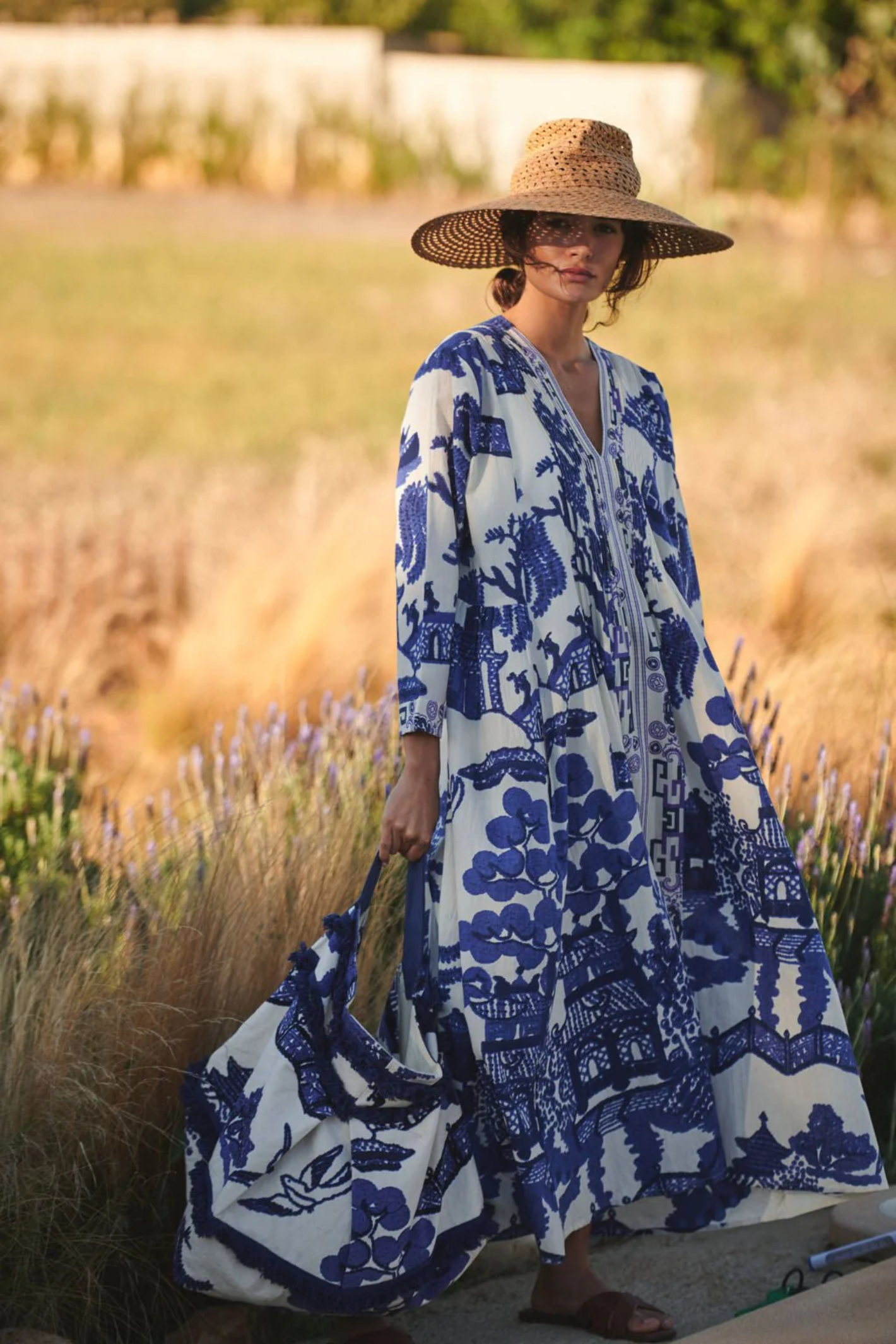 Statement maxi dress by One Hundred Stars in the Giant Willow Blue print. Made from 100% organic cotton with pleat detail and pockets — perfect for summer. Shop at Dotique.
