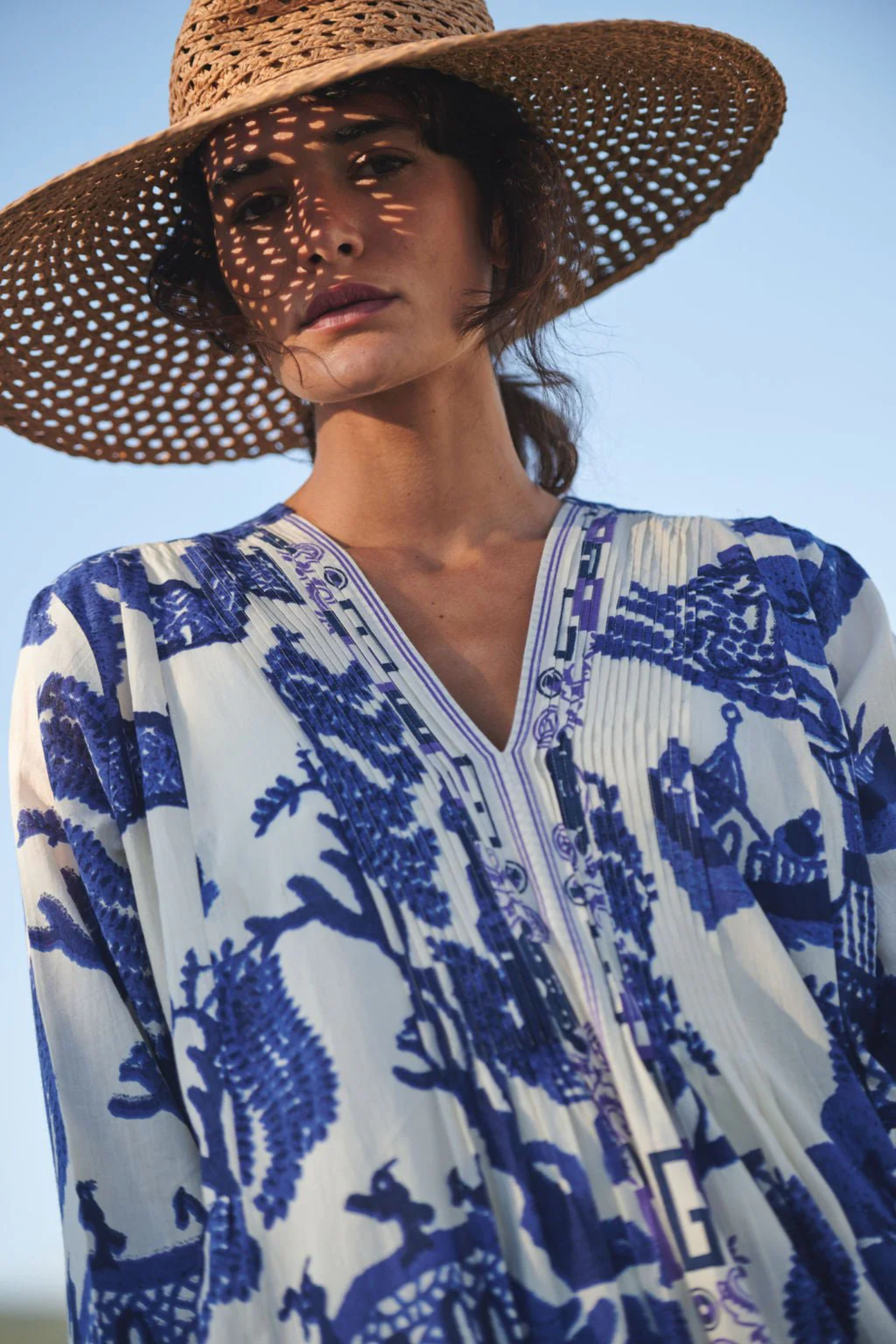 Statement maxi dress by One Hundred Stars in the Giant Willow Blue print. Made from 100% organic cotton with pleat detail and pockets — perfect for summer. Shop at Dotique.