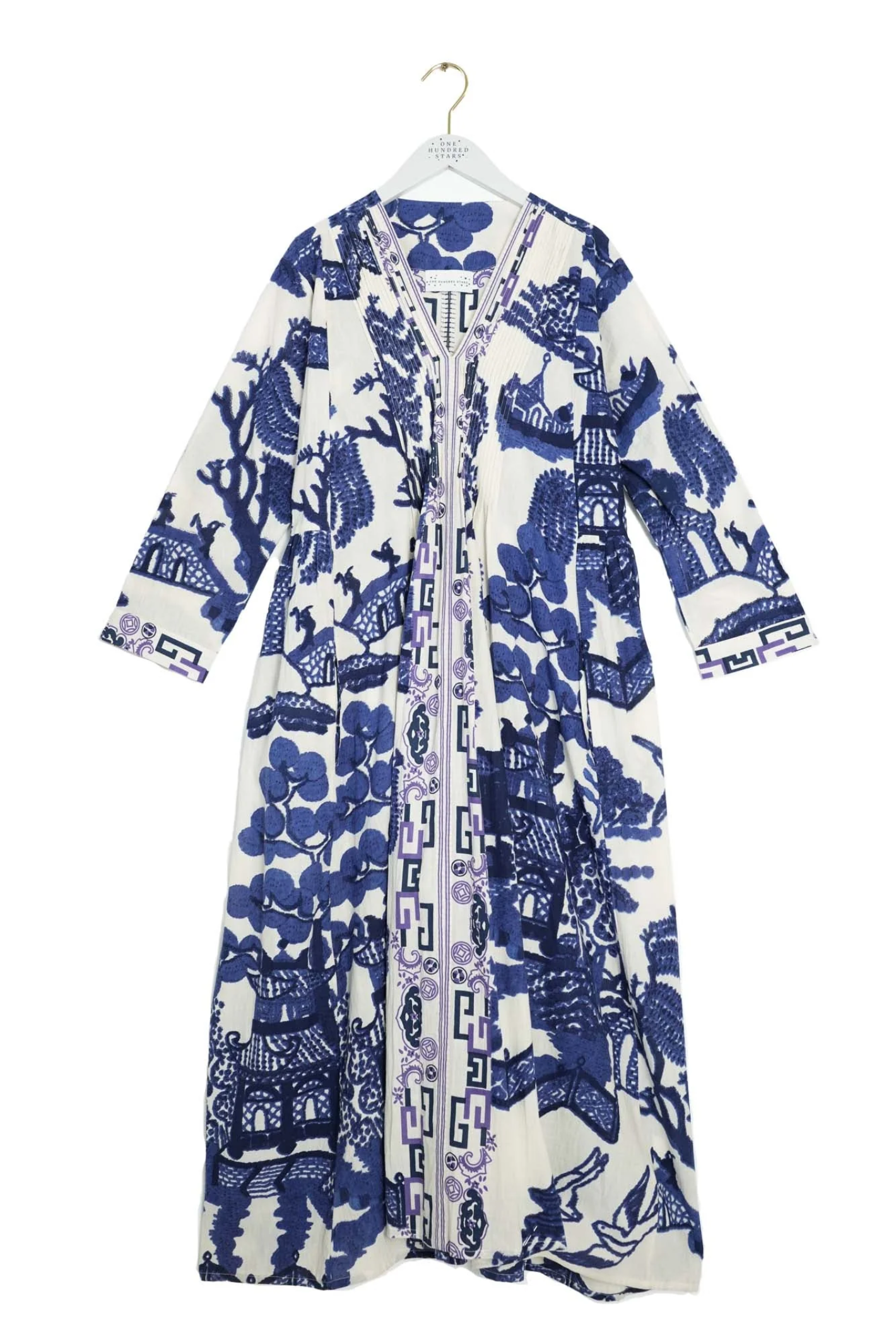 Statement maxi dress by One Hundred Stars in the Giant Willow Blue print. Made from 100% organic cotton with pleat detail and pockets — perfect for summer. Shop at Dotique.