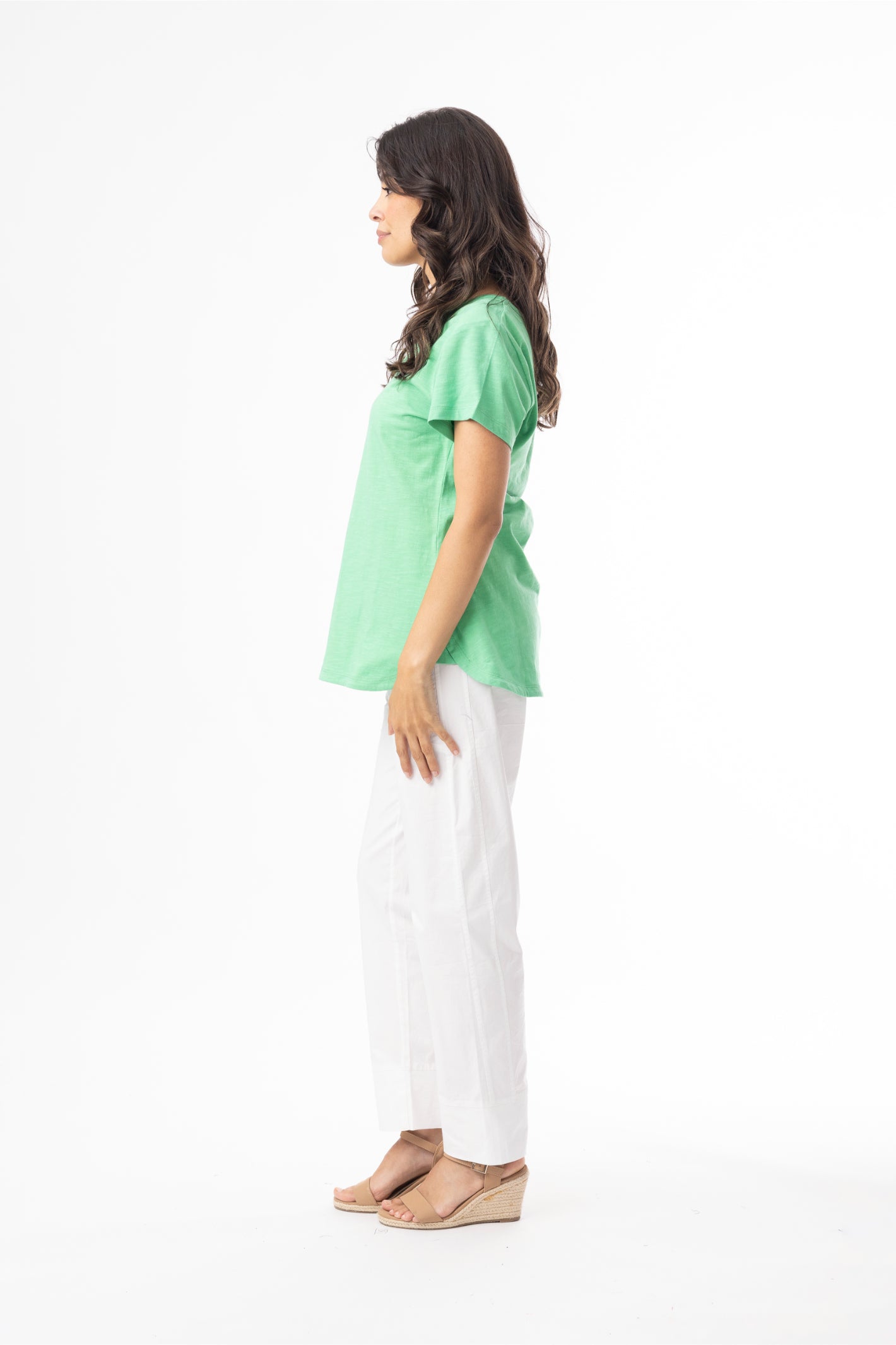 Model wearing Orientique 92129 Knit Essentials V-neck Tee Green by orientique, shop orientique styles at Dotique in side profile