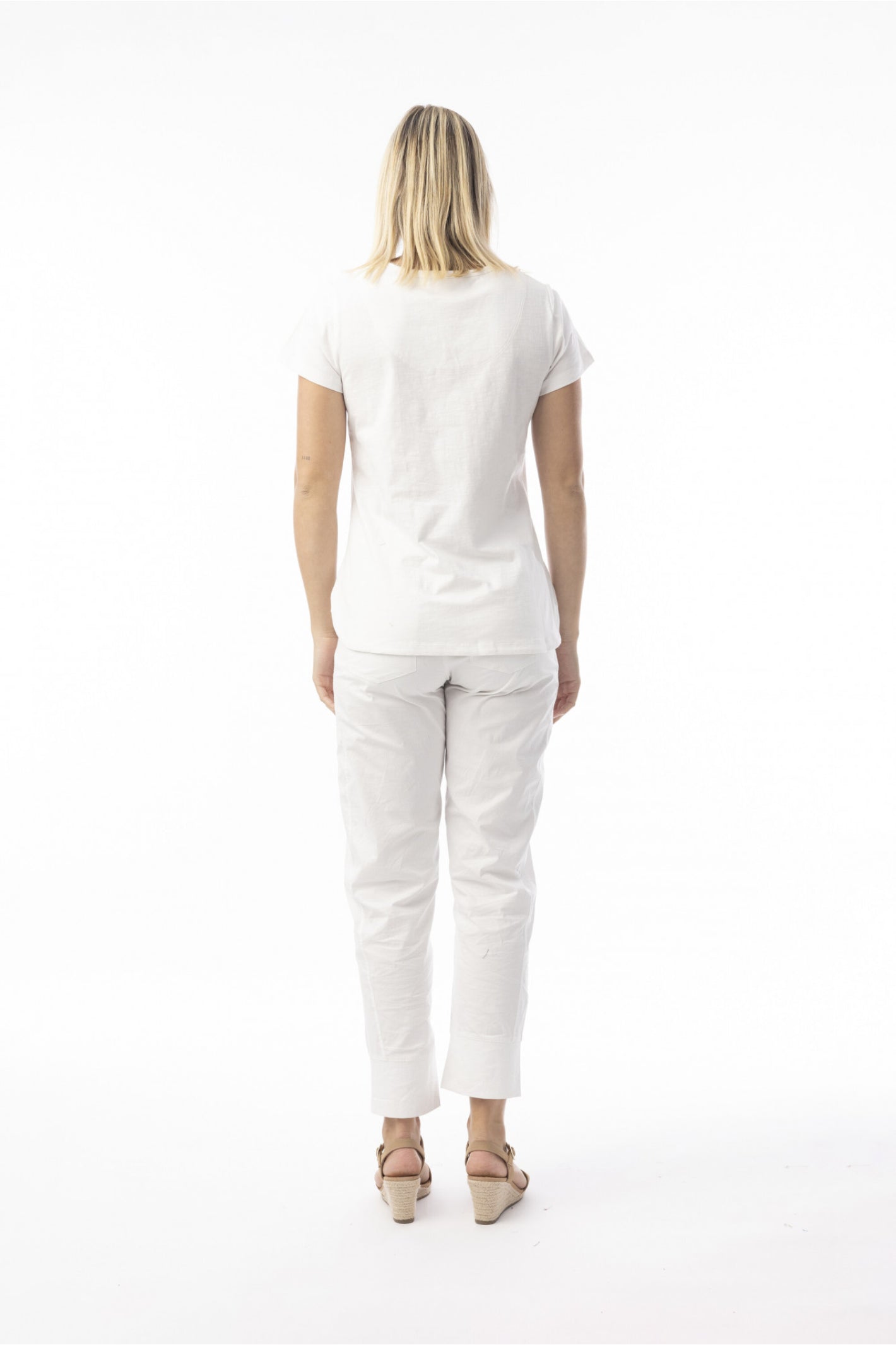 Model showing back view of Orientique 92129 Knit Essentials V-neck Tee White by orientique, shop orientique at Dotique
