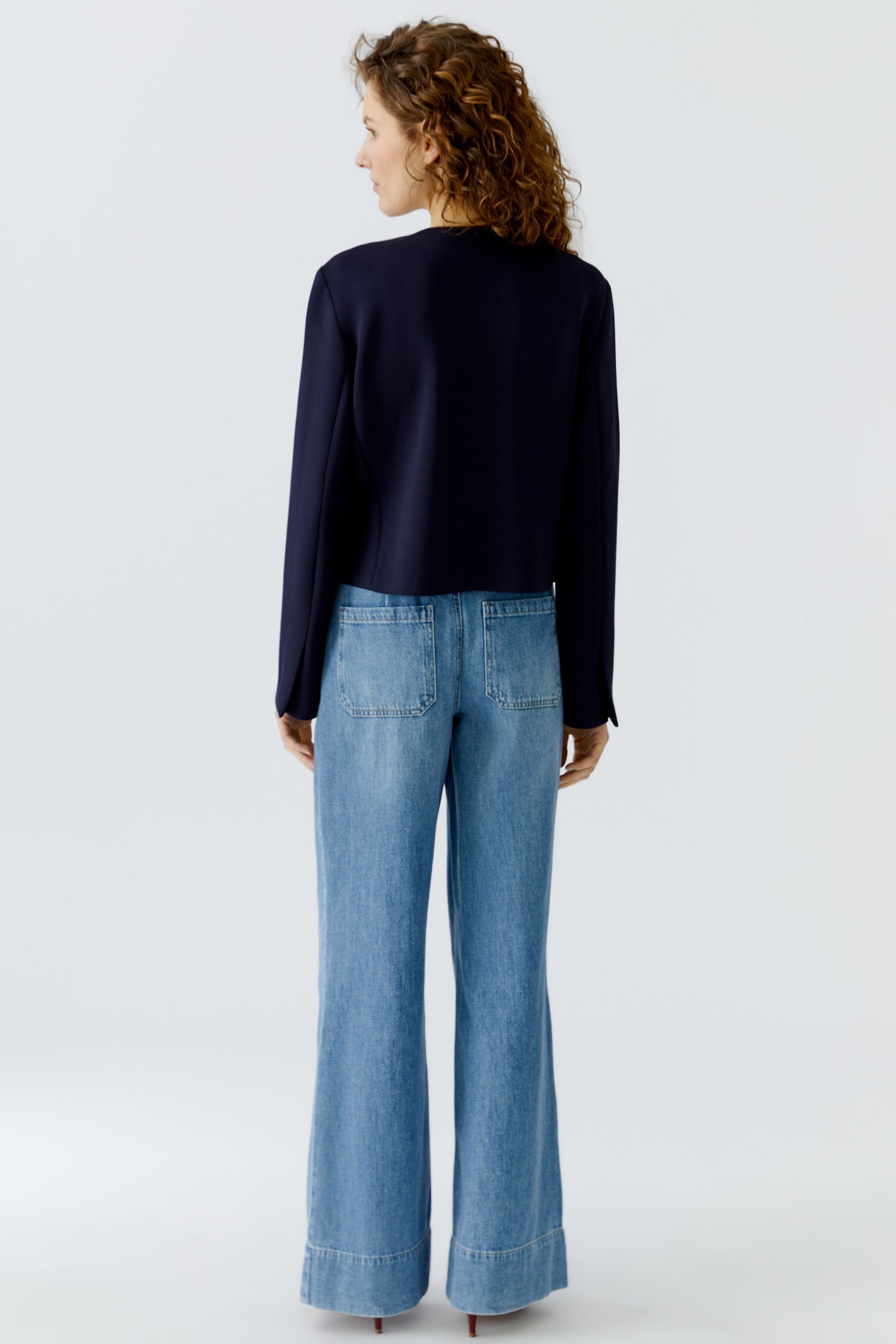 Back view of a woman wearing Oui 96341 Navy Blue Collarless Jacket with Gold Buttons by Oui, shop Oui at Dotique.