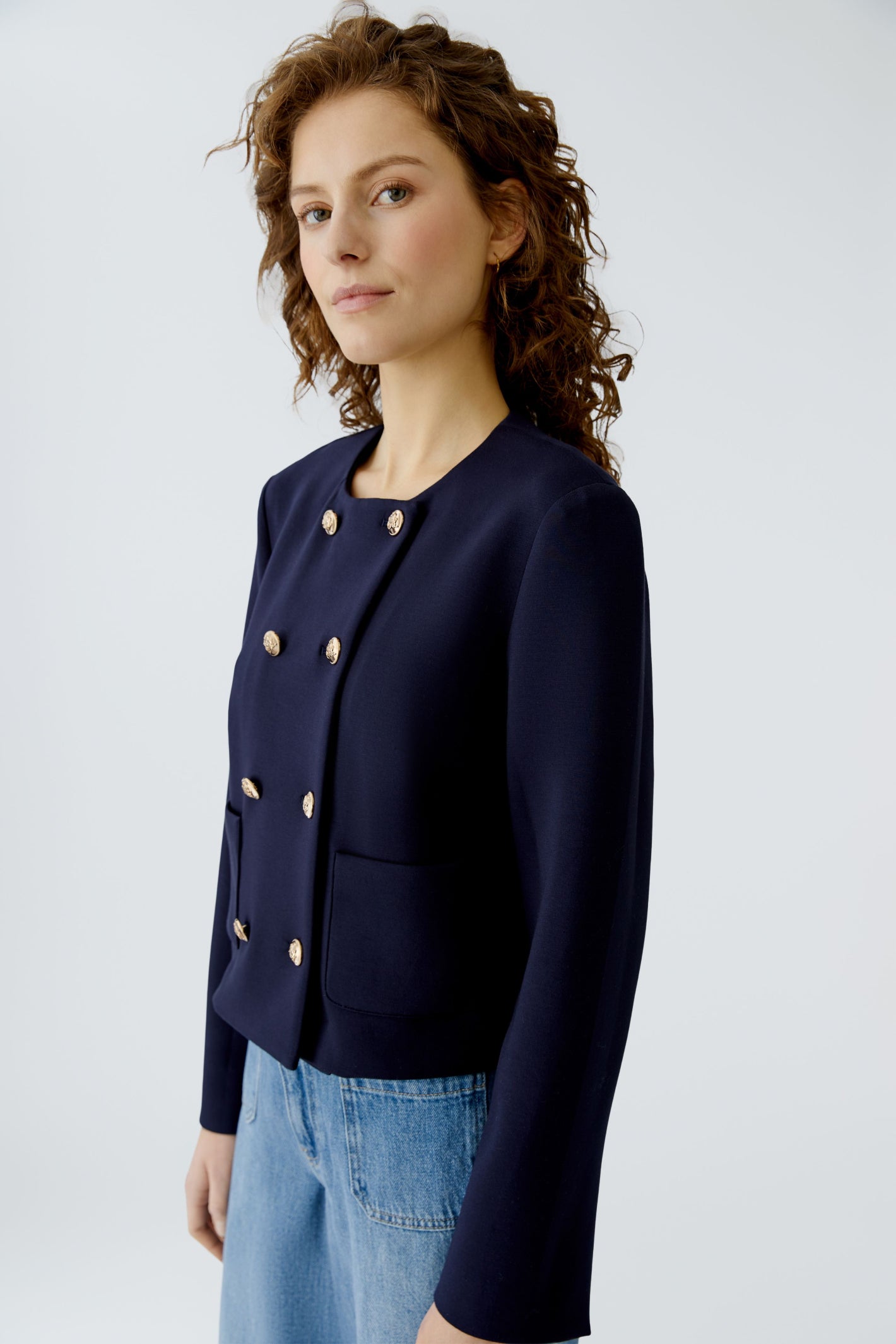 Woman modeling Oui 96341 Navy Blue Collarless Jacket with Gold Buttons by Oui Shop Oui at Dotique in soft structured silhouette