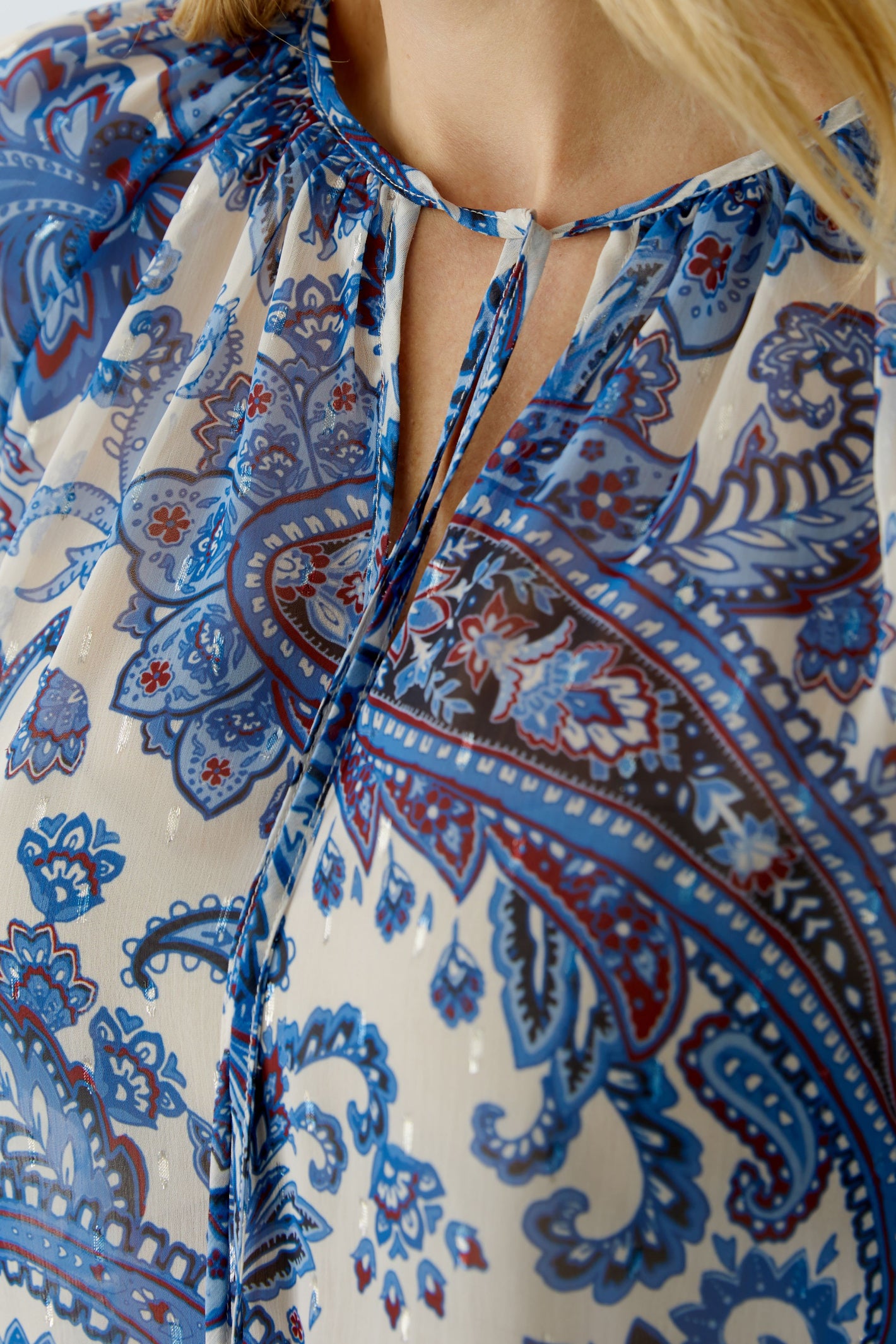 Close-up of Oui 96462 Blue Patterned Blouse with Tie Neck by Oui, shop the Oui collection at Dotique online store.