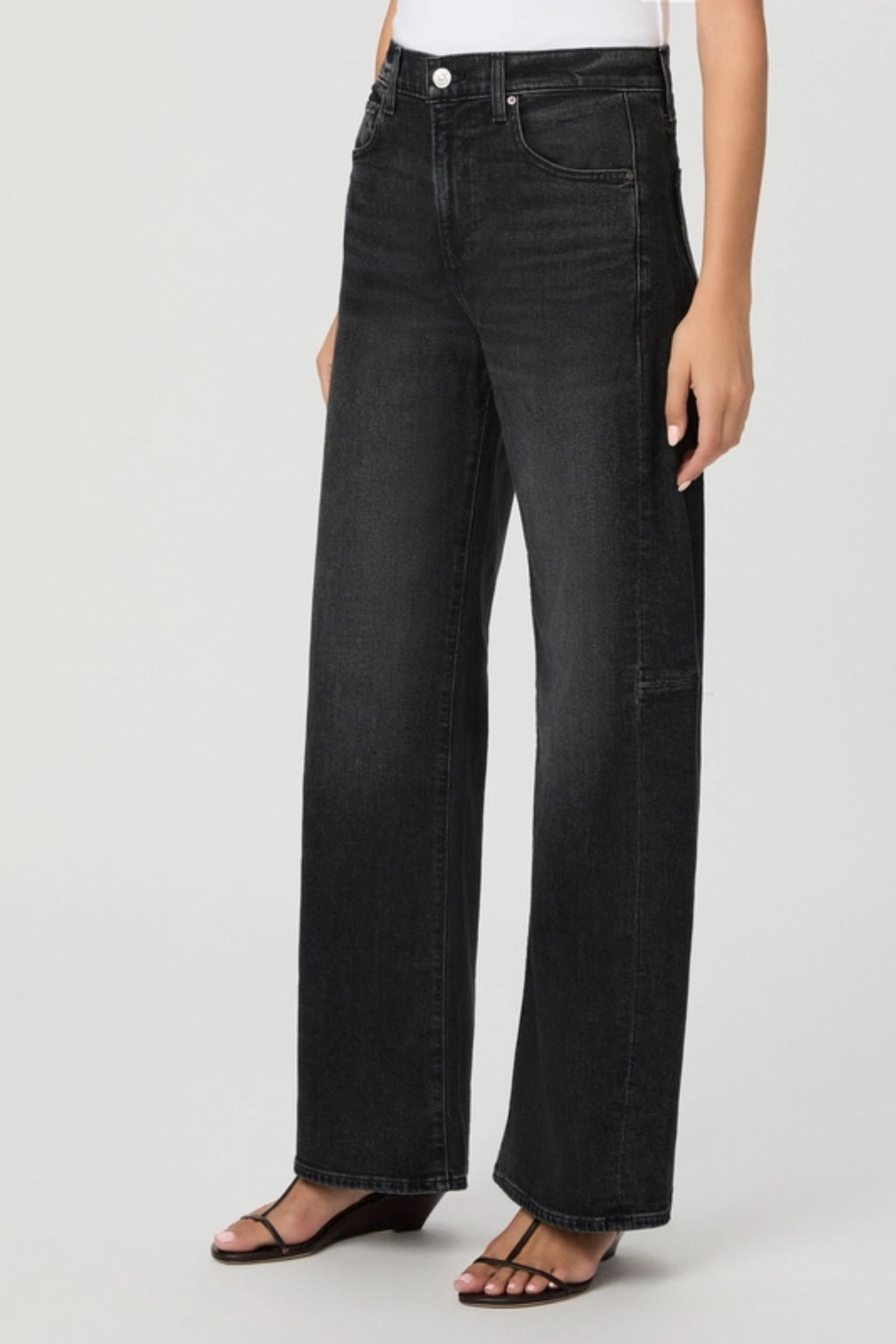Shop the PAIGE Arellia Skimmer Jeans in Oscura at Dotique. High-rise barrel-leg jeans with flattering outseam panels, premium denim and a versatile dark wash.