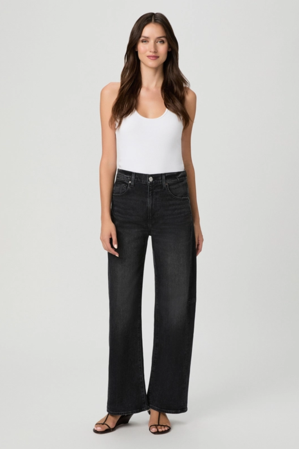 Shop the PAIGE Arellia Skimmer Jeans in Oscura at Dotique. High-rise barrel-leg jeans with flattering outseam panels, premium denim and a versatile dark wash.