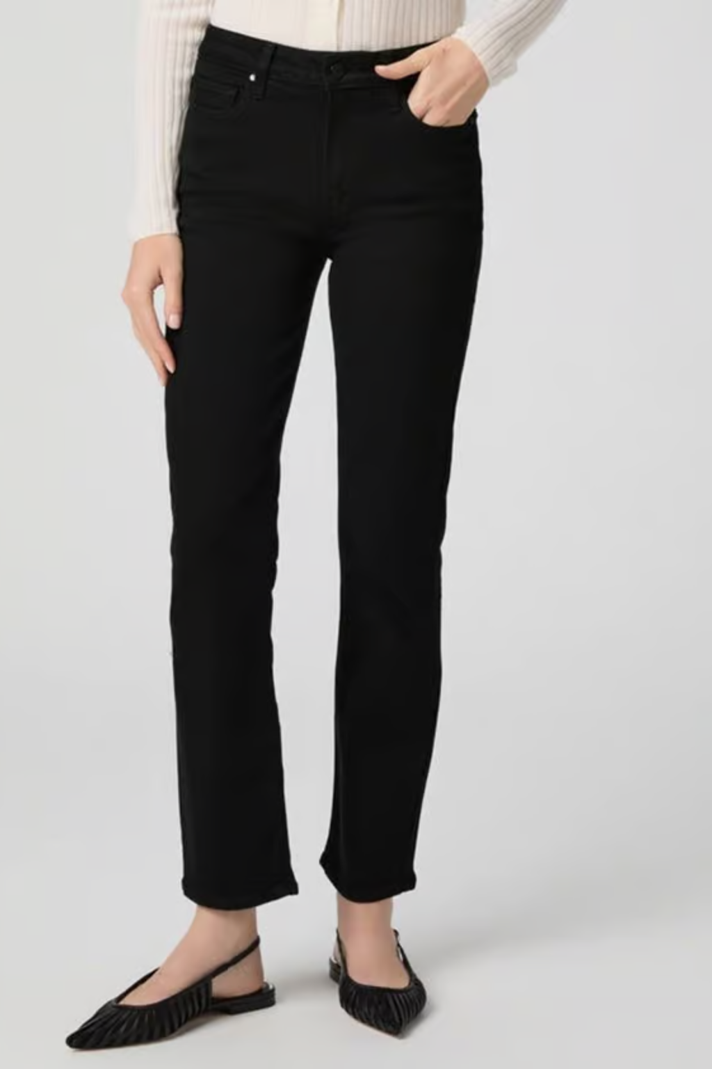 Woman wearing PAIGE Cindy High Rise Straight Ankle Jeans Black Shadow in classic black paired with a white ribbed top by PAIGE. Shop PAIGE at Dotique.