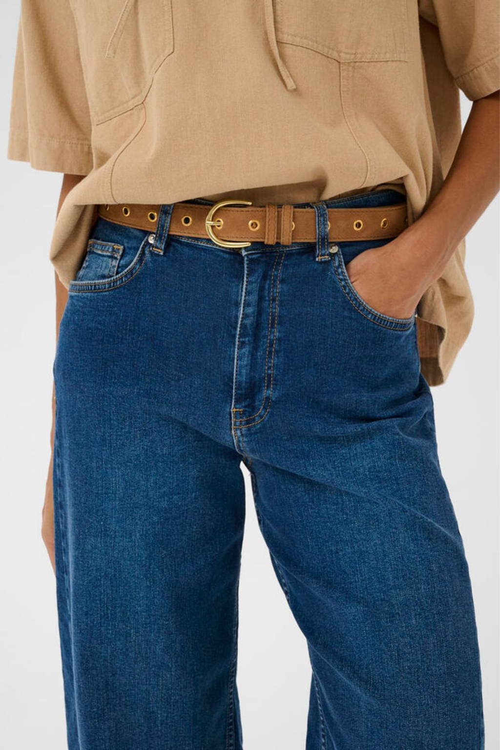 Suede leather belt by Part Two in toasted coconut with metal stud detailing. Easy to style with jeans or dresses. Shop now at Dotique.