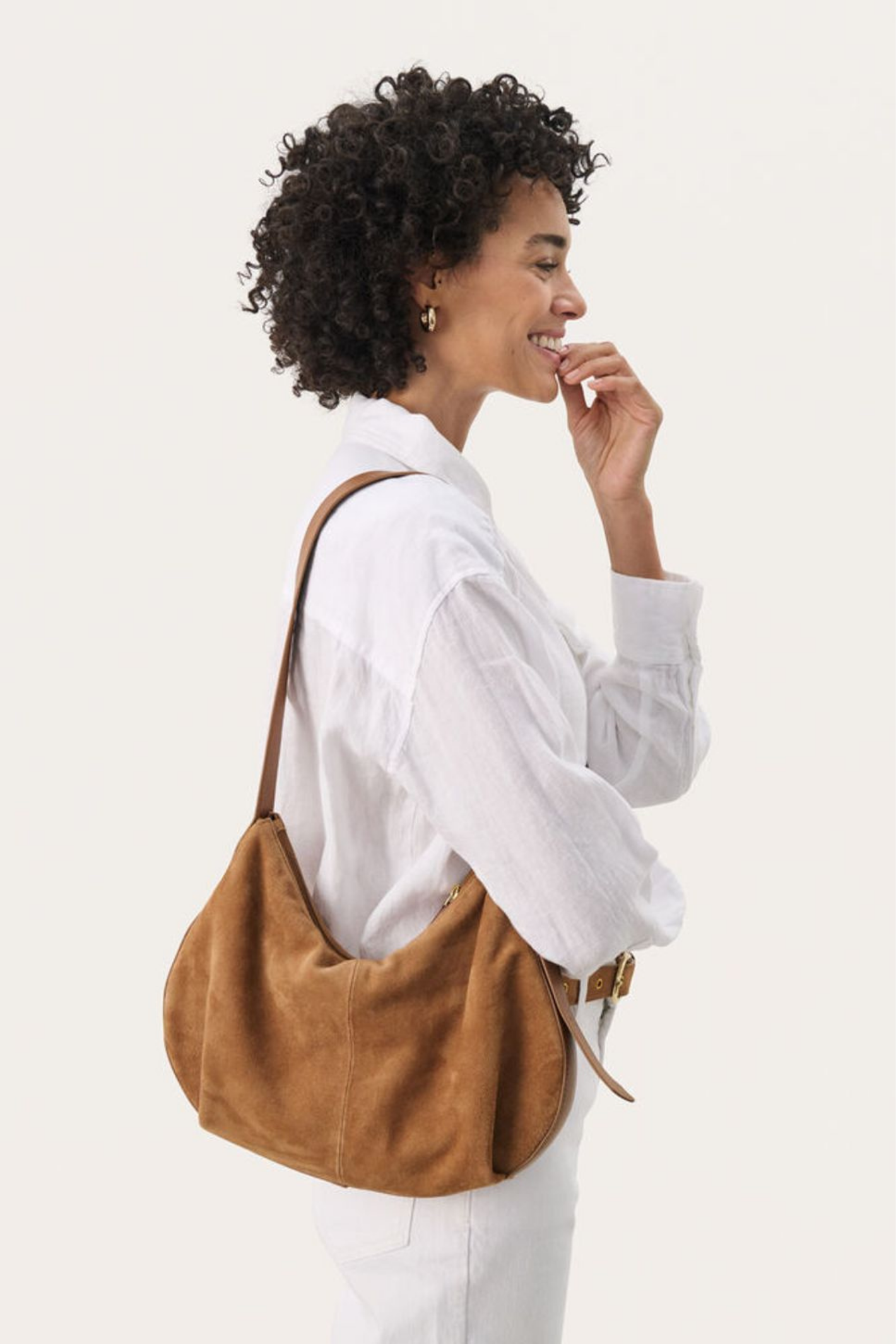 Soft suede shoulder bag by Part Two in toasted coconut with adjustable strap and zip closure. A timeless everyday bag. Shop at Dotique.