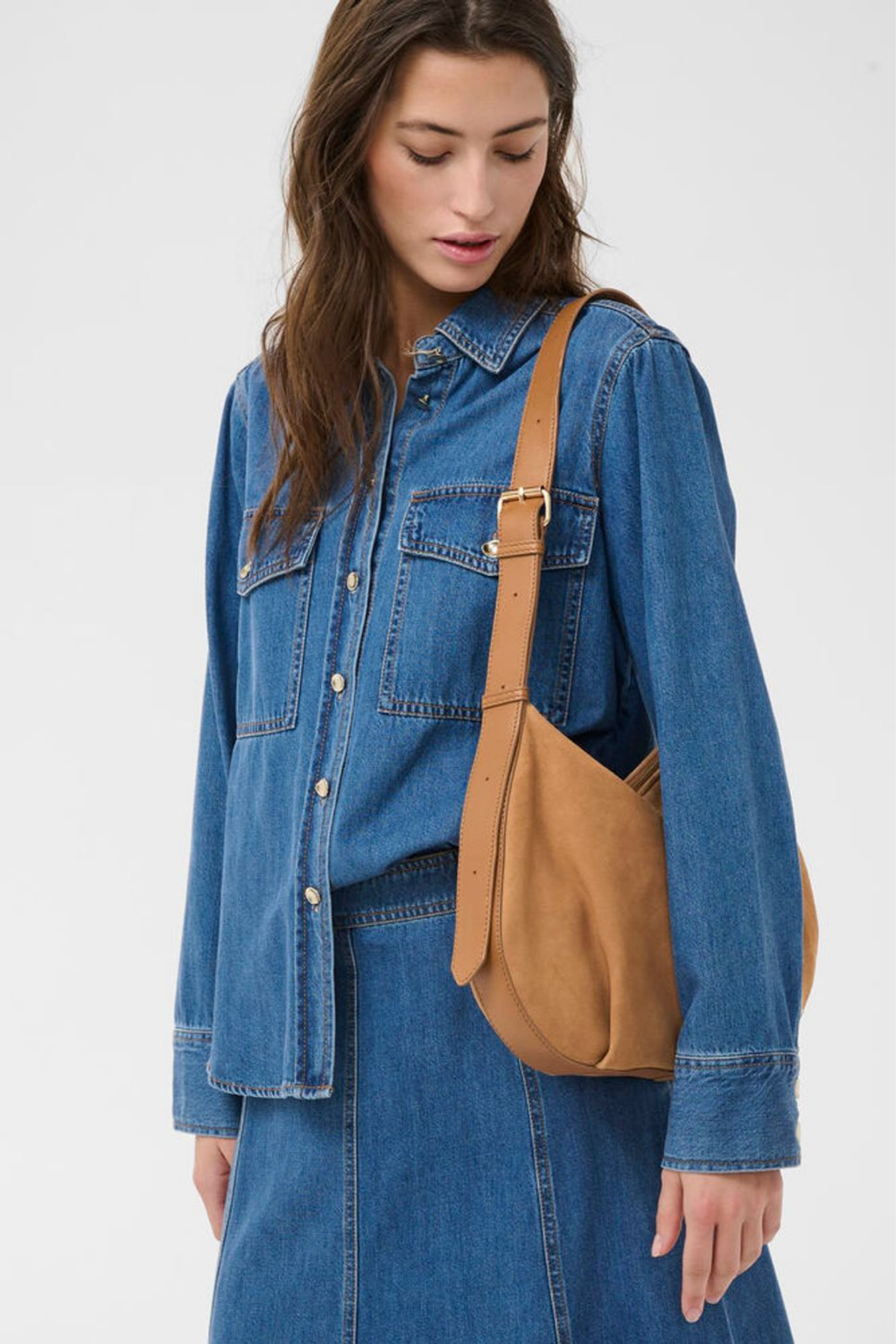 Soft suede shoulder bag by Part Two in toasted coconut with adjustable strap and zip closure. A timeless everyday bag. Shop at Dotique.