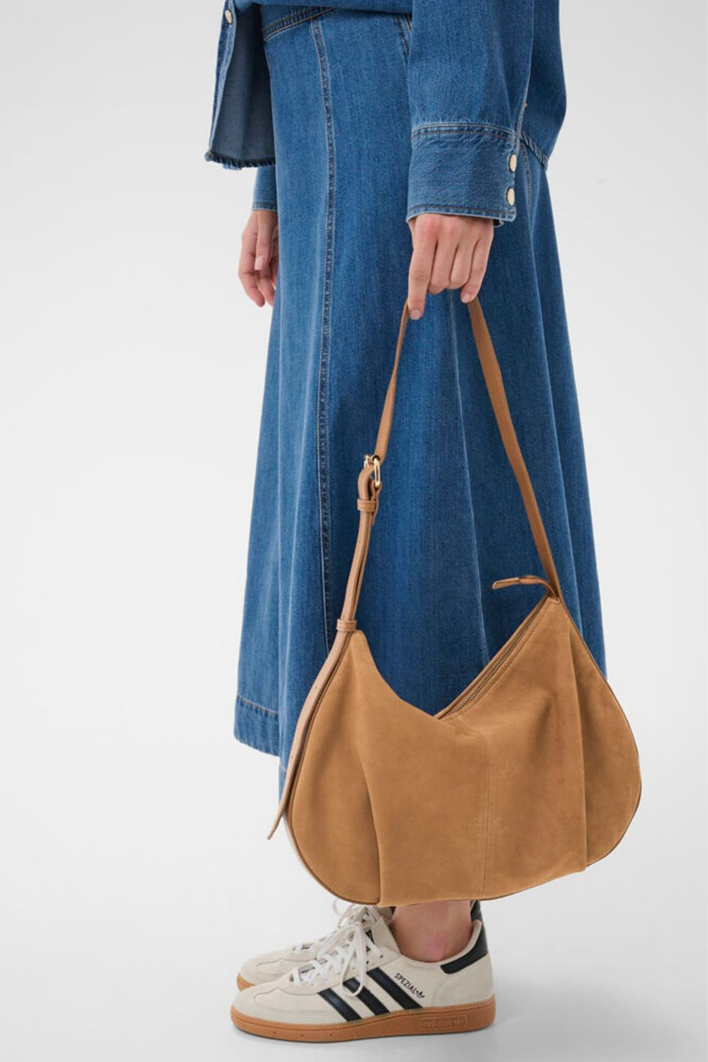 Soft suede shoulder bag by Part Two in toasted coconut with adjustable strap and zip closure. A timeless everyday bag. Shop at Dotique.