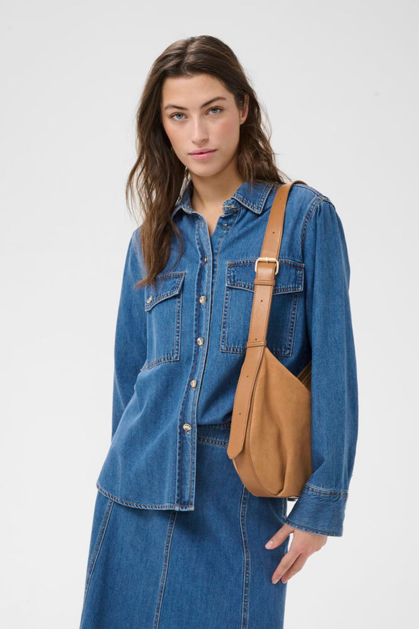 Soft suede shoulder bag by Part Two in toasted coconut with adjustable strap and zip closure. A timeless everyday bag. Shop at Dotique.