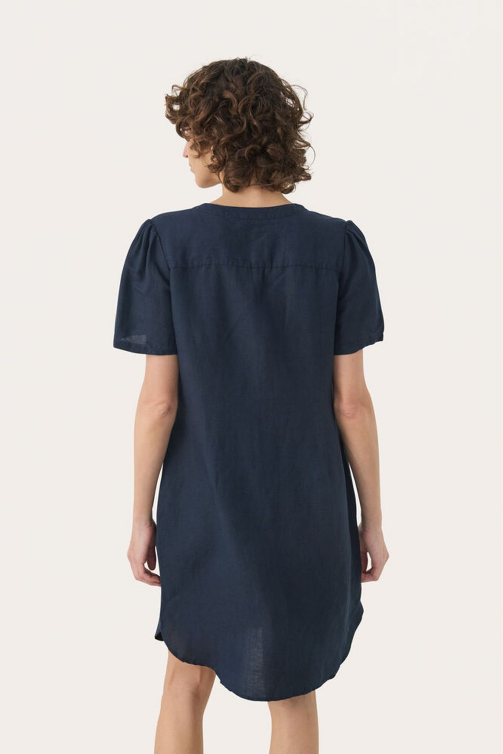 Relaxed linen blend dress by Part Two in after midnight with V-neck and short sleeves. Easy summer style. Shop at Dotique.