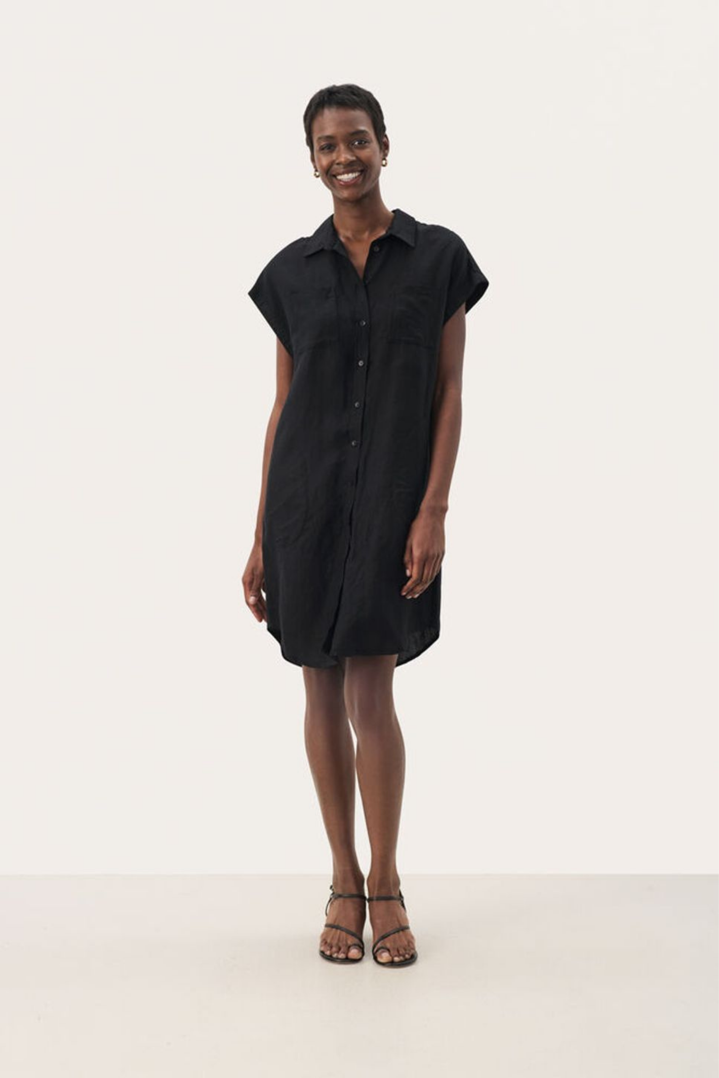Timeless black linen shirt dress by Part Two. Lightweight, breathable and easy to style for summer days and holidays.