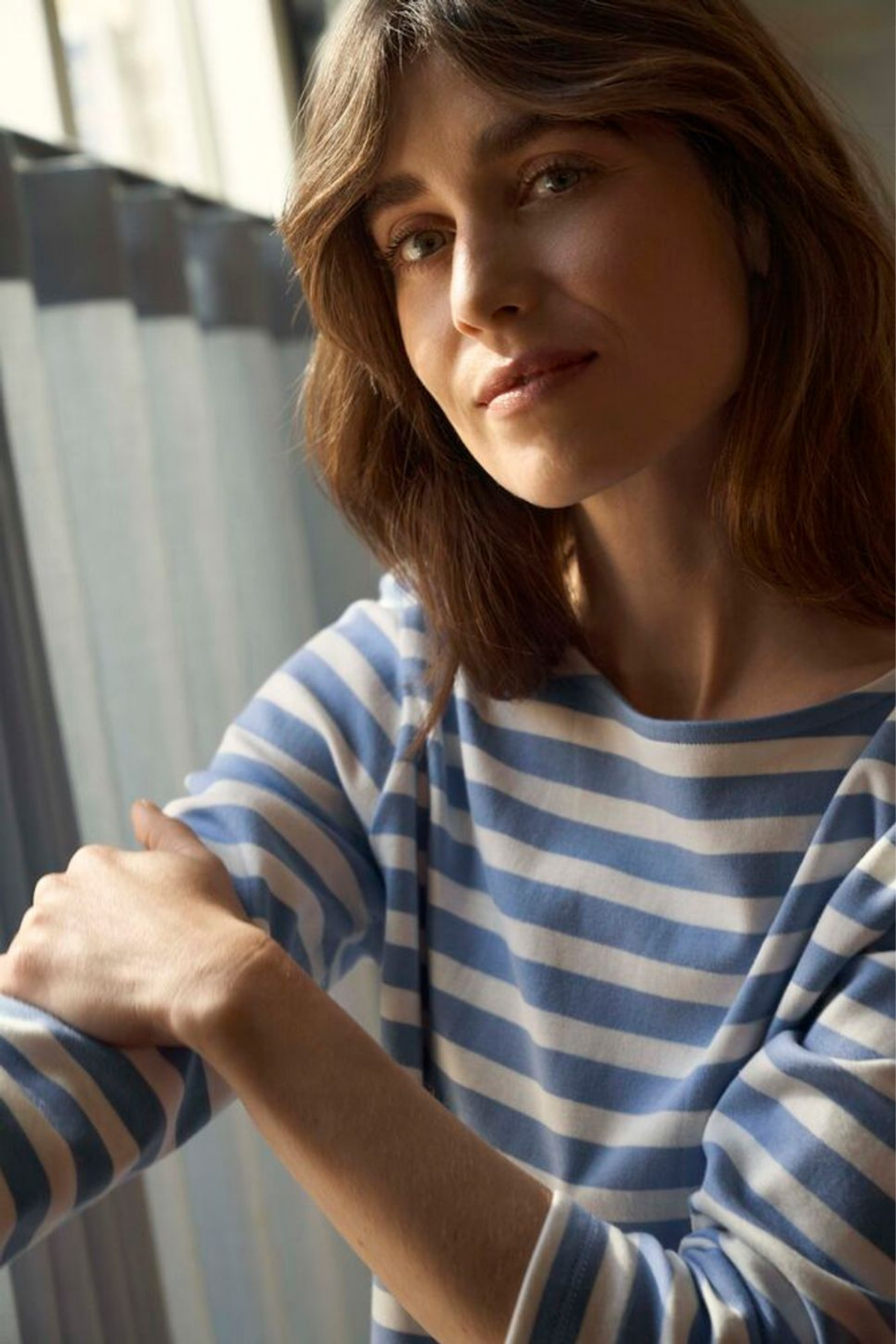 Woman wearing a blue and white striped Part Two 30309864 NelaPW Hydrangea Stripe T-shirt by Part Two Shop at Dotique