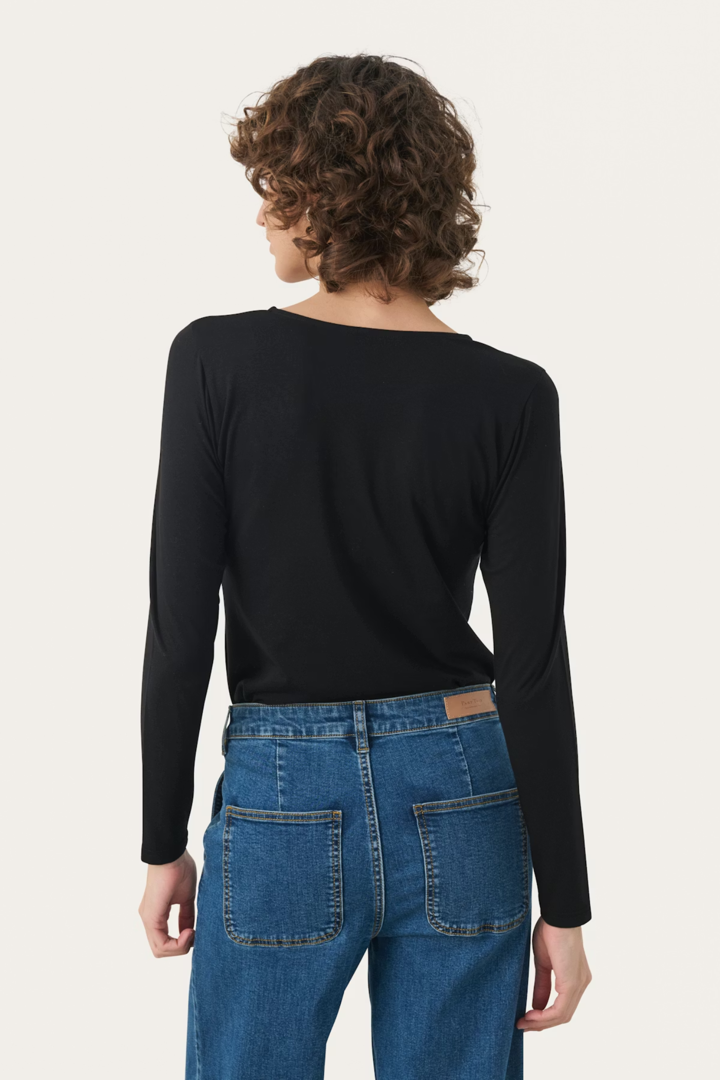 Soft long sleeve T-shirt by Part Two in black. Made with TENCEL™ Modal and organic cotton for a smooth, flattering fit. Shop Dotique.