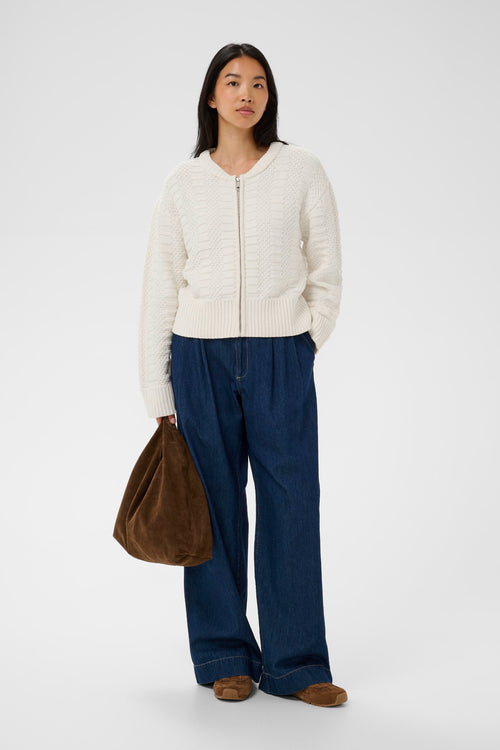 Model wearing Part Two 30310397 AnielaPW Whisper White Cardigan styled with wide leg jeans Shop Part Two at Dotique