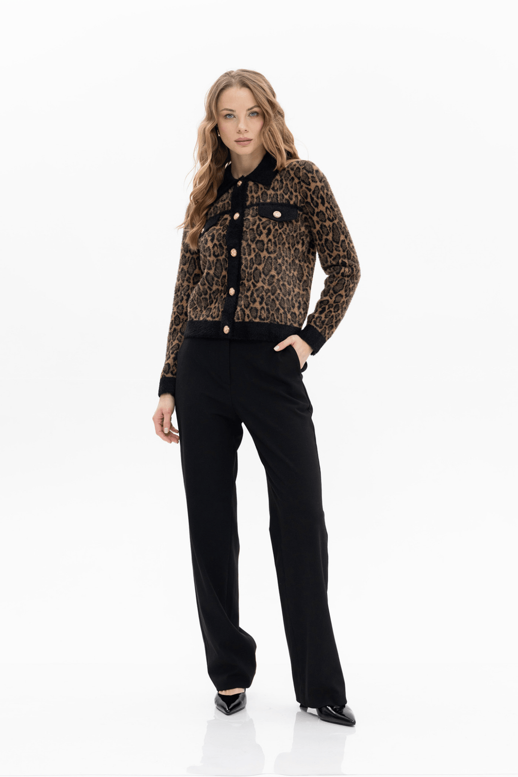 Passioni leopard print cardigan. . Featuring a bold leopard design with black trim and gold statement buttons. Available at Dotique