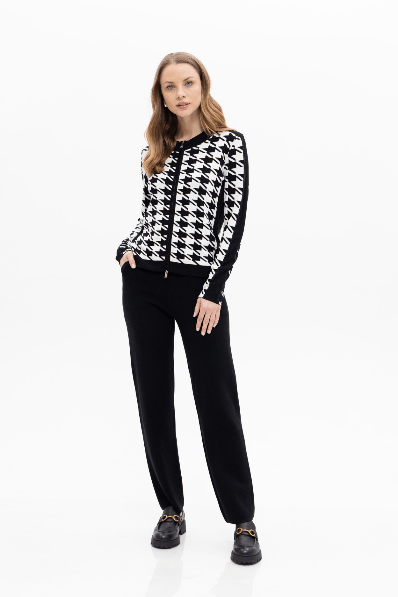 Passioni 18127 Black &amp; White Cardigan. Featuring a bold houndstooth pattern, sleek zip fastening, and sporty side stripe detail