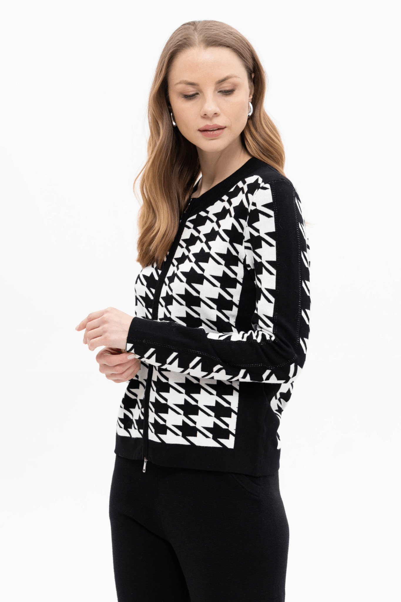 Passioni 18127 Black &amp; White Cardigan. Featuring a bold houndstooth pattern, sleek zip fastening, and sporty side stripe detail