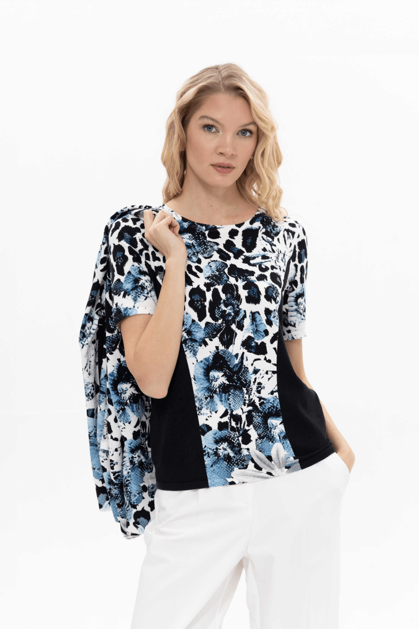 Passioni twinset. Featuring a striking jean blue leopard print, this top and cardigan set creates a coordinated look with minimal effort. Available at Dotique