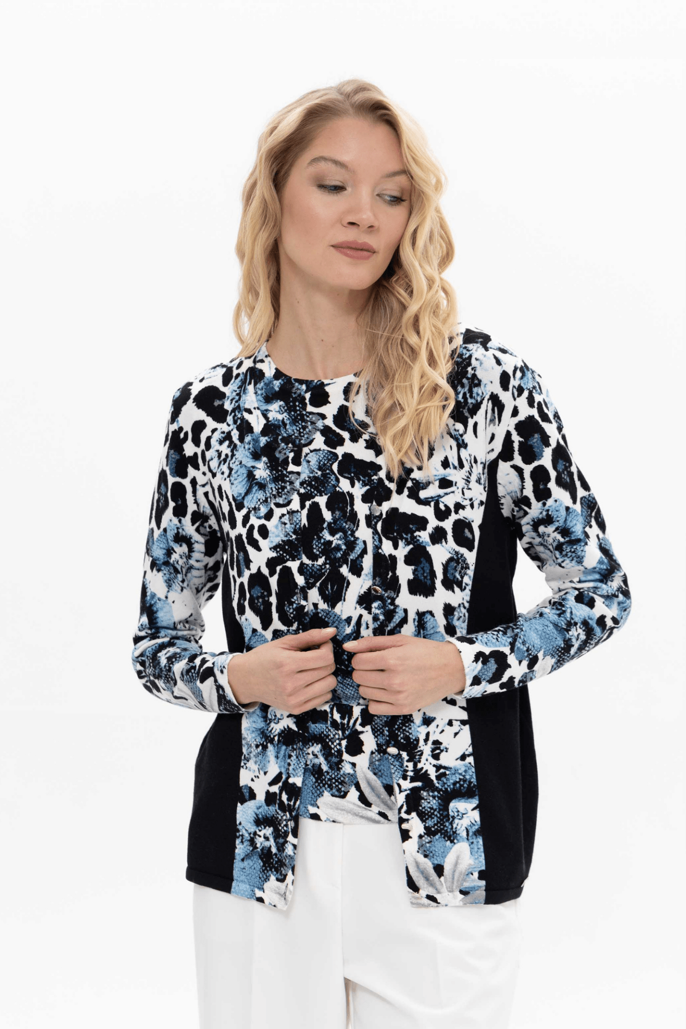 Passioni twinset. Featuring a striking jean blue leopard print, this top and cardigan set creates a coordinated look with minimal effort. Available at Dotique